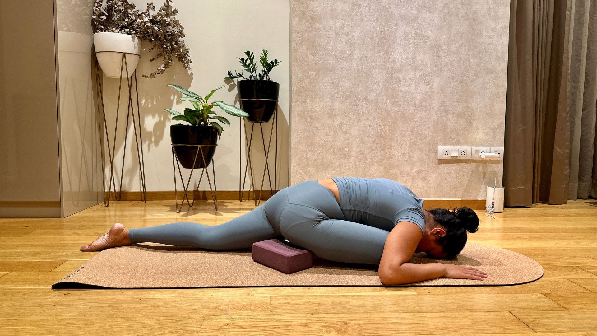 Supported pigeon pose