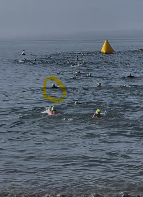 Jivana Heyman swimming in the Pacific Ocean during his first triathlon