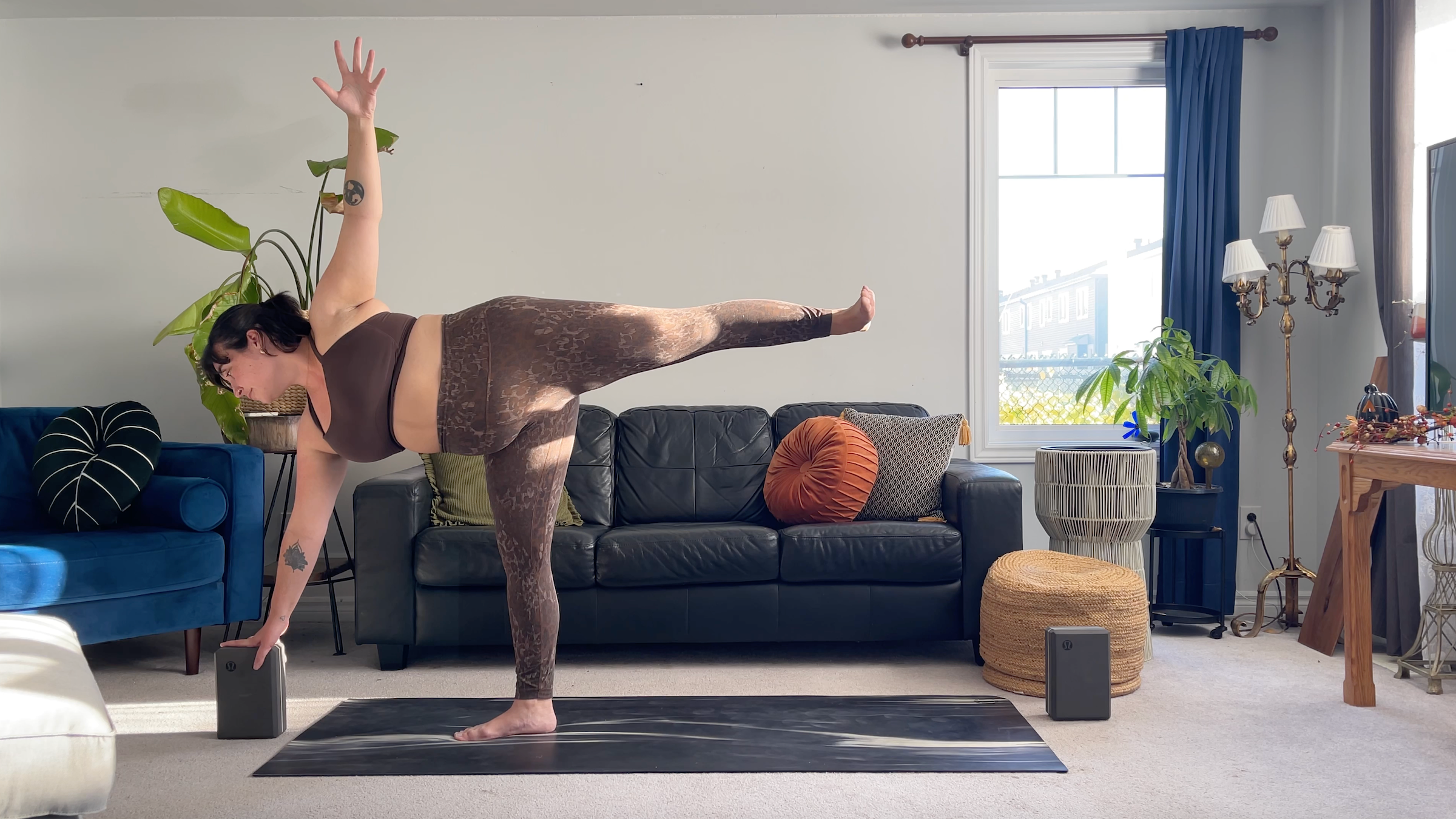 Teacher Taylor Lorenz in in Half Moon Pose