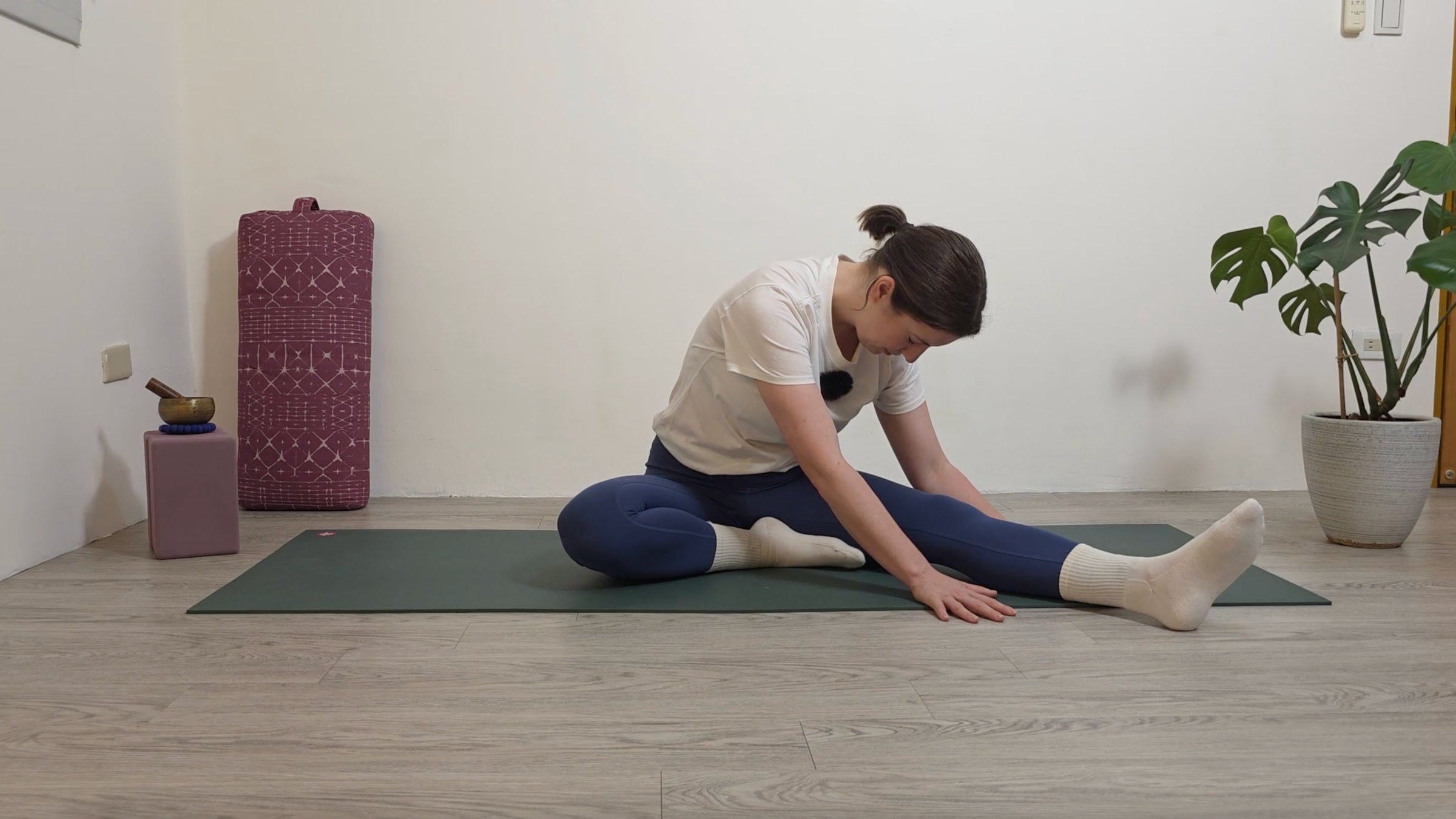 Yoga teacher Katie McGrath in Half Butterfly, part of her morning yin yoga practice