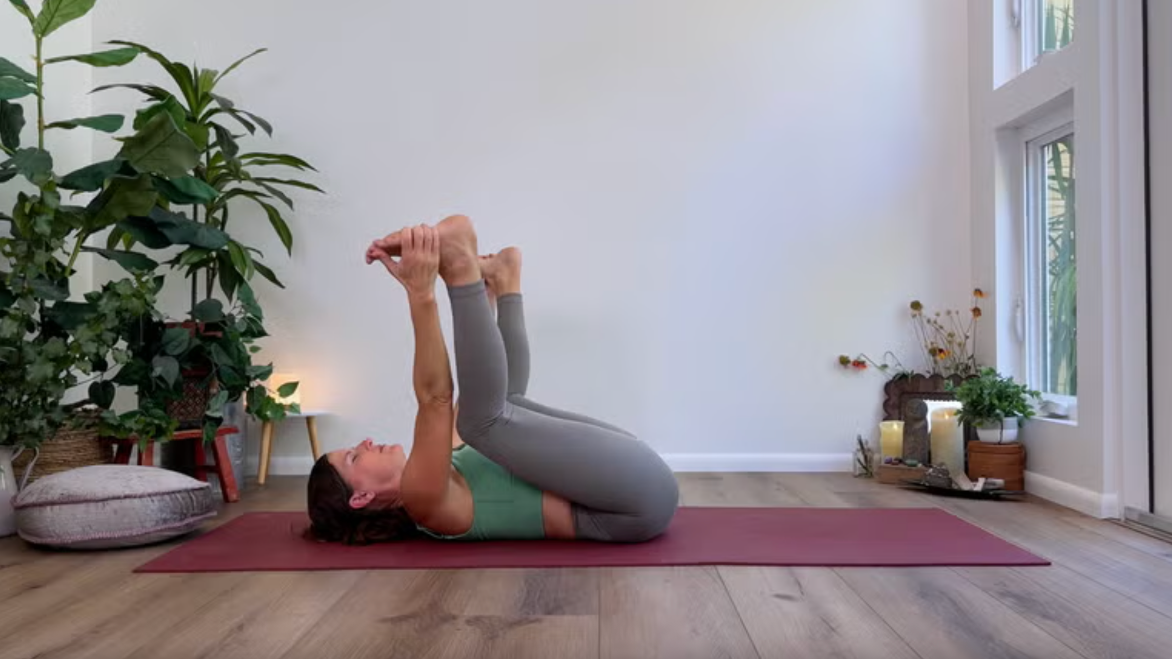 Yoga teacher Devi Daly in Happy Baby, part of her morning yoga practice