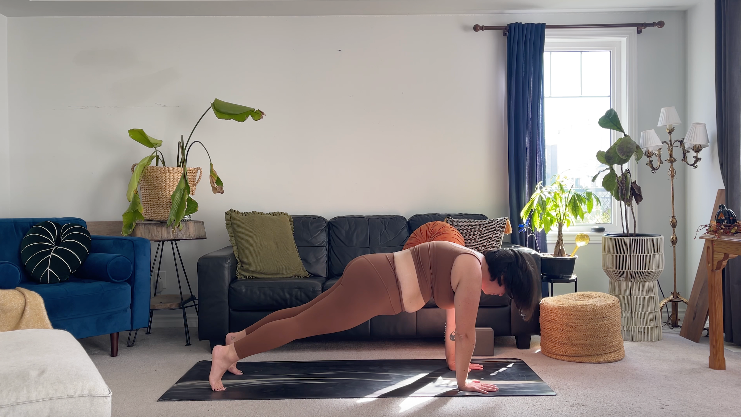 Yoga teacher Taylor Lorenz in Plank Pose, part of her morning yoga routine