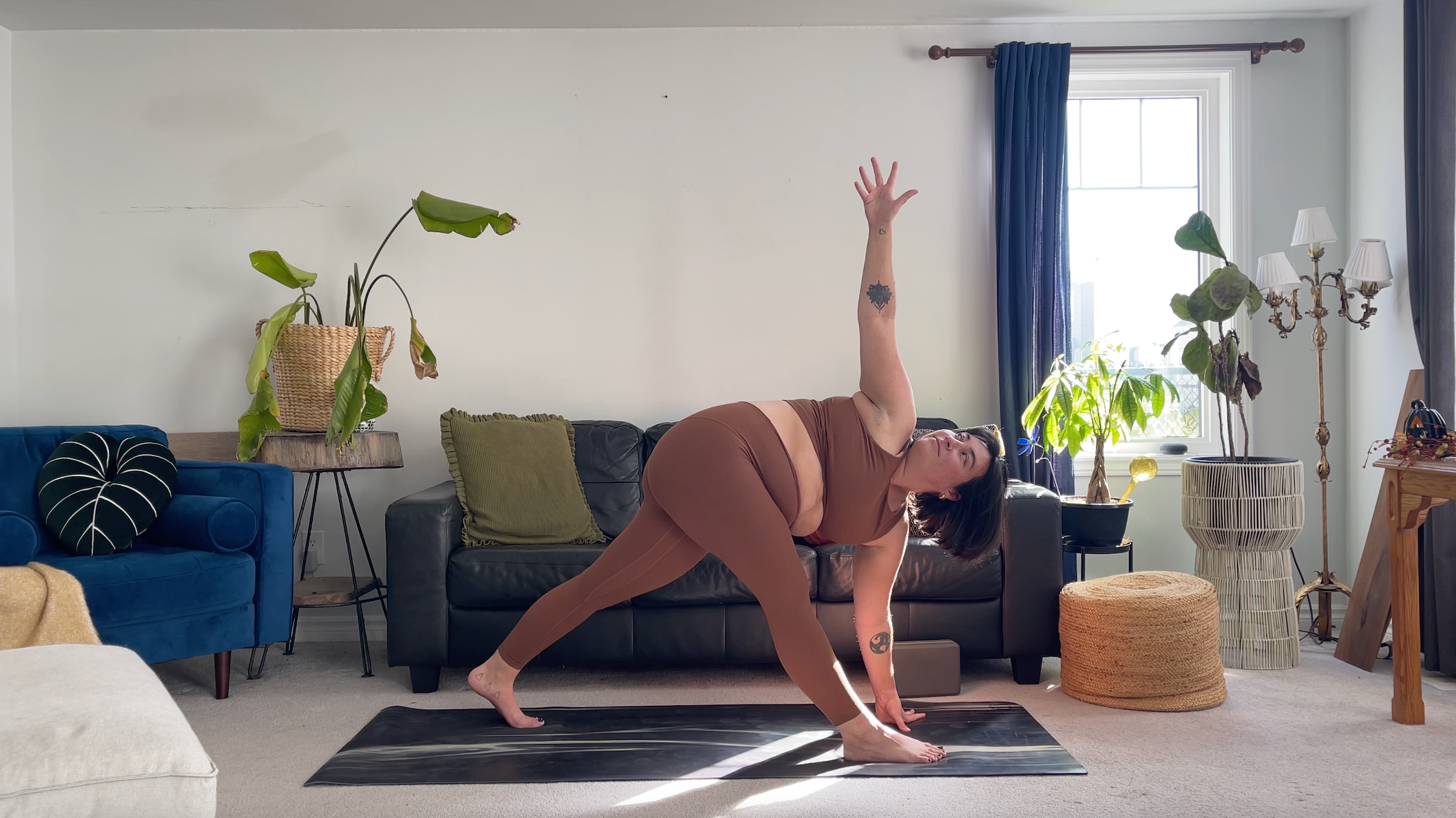 Teacher Taylor Lorenz in Revolved Pyramid Pose