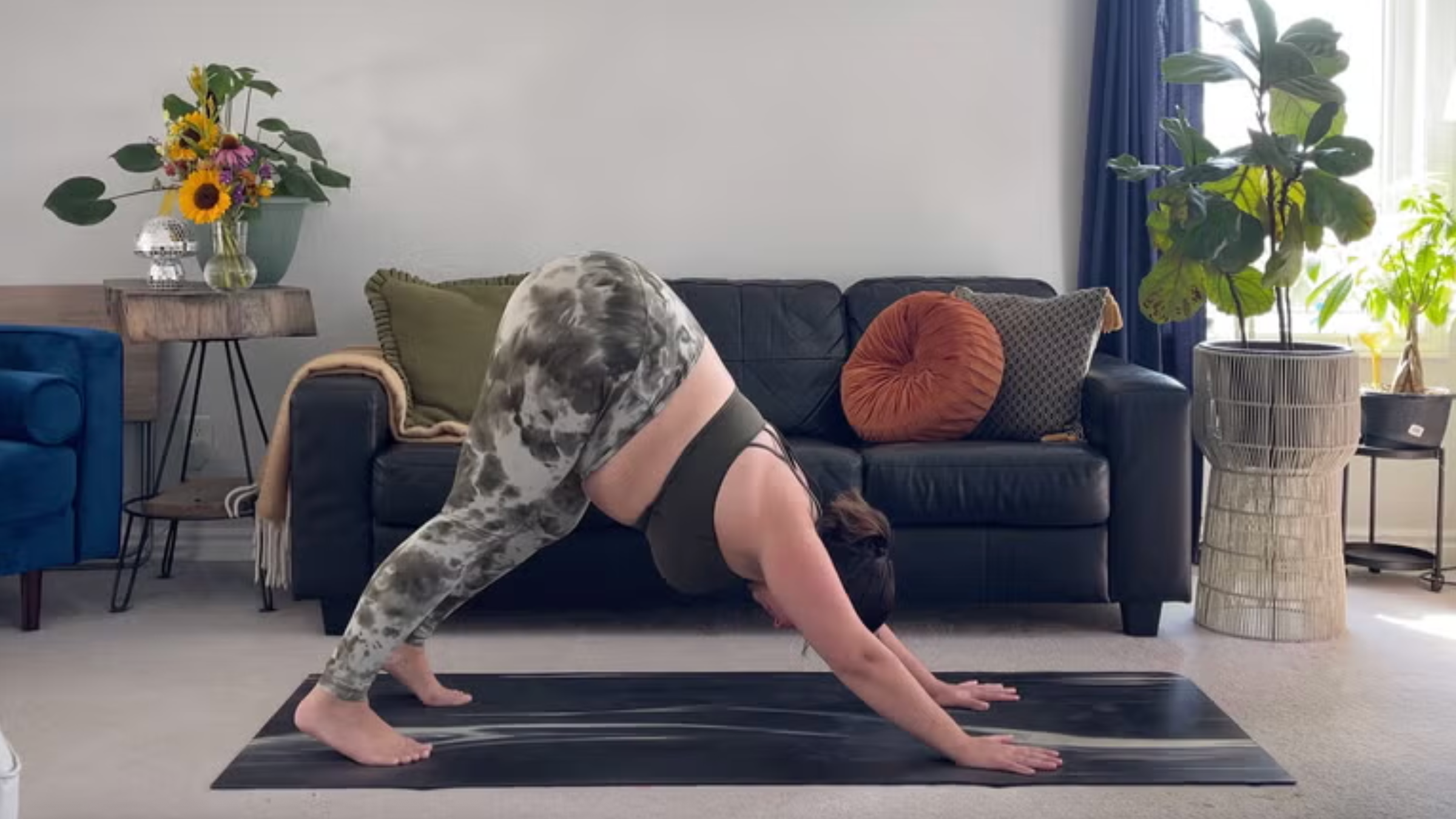 Yoga teacher Taylor Lorenz in Downward Dog, part of her morning yoga practice