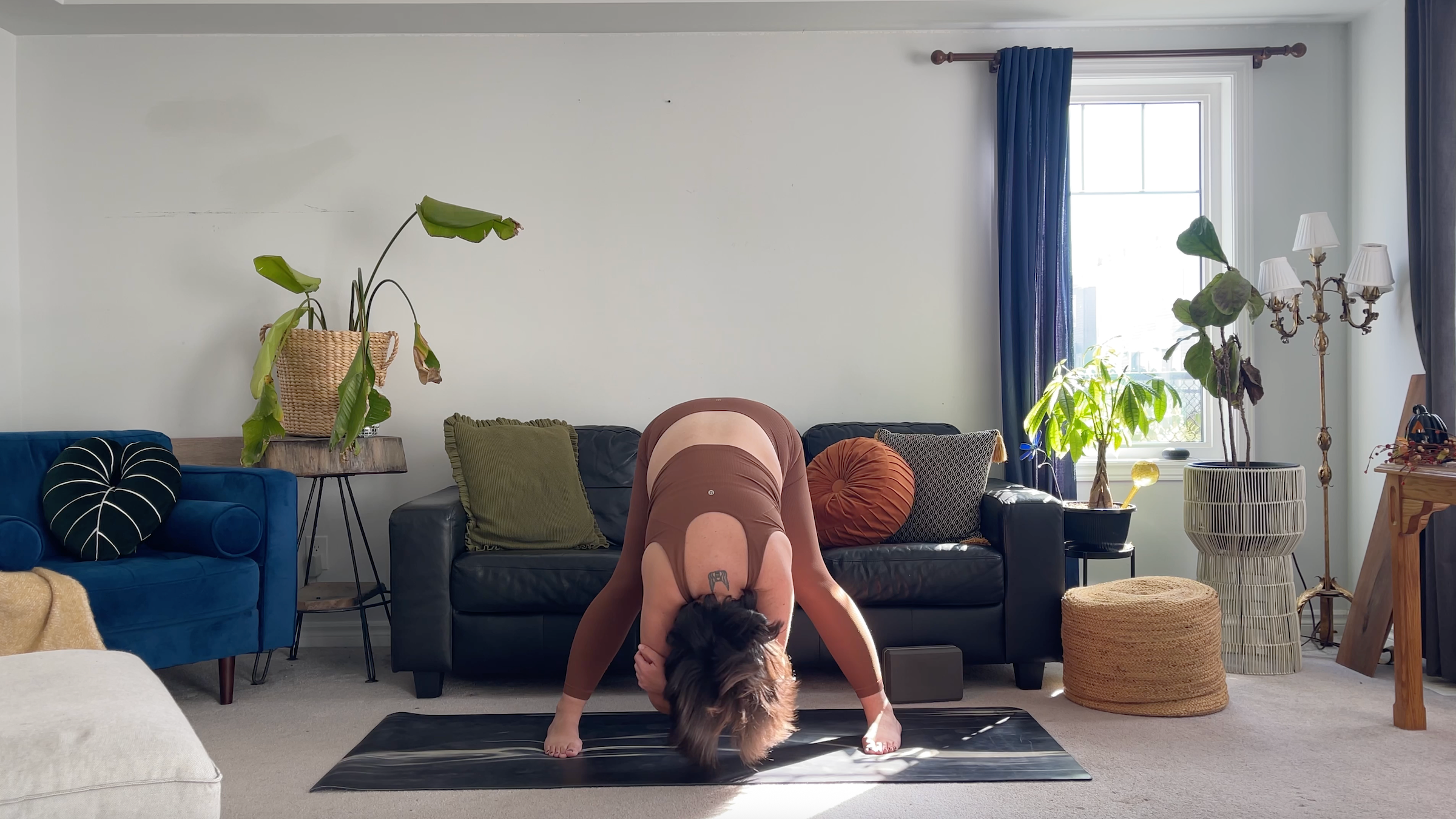 Teacher Taylor Lorenz in Wide-Legged Forward Bend