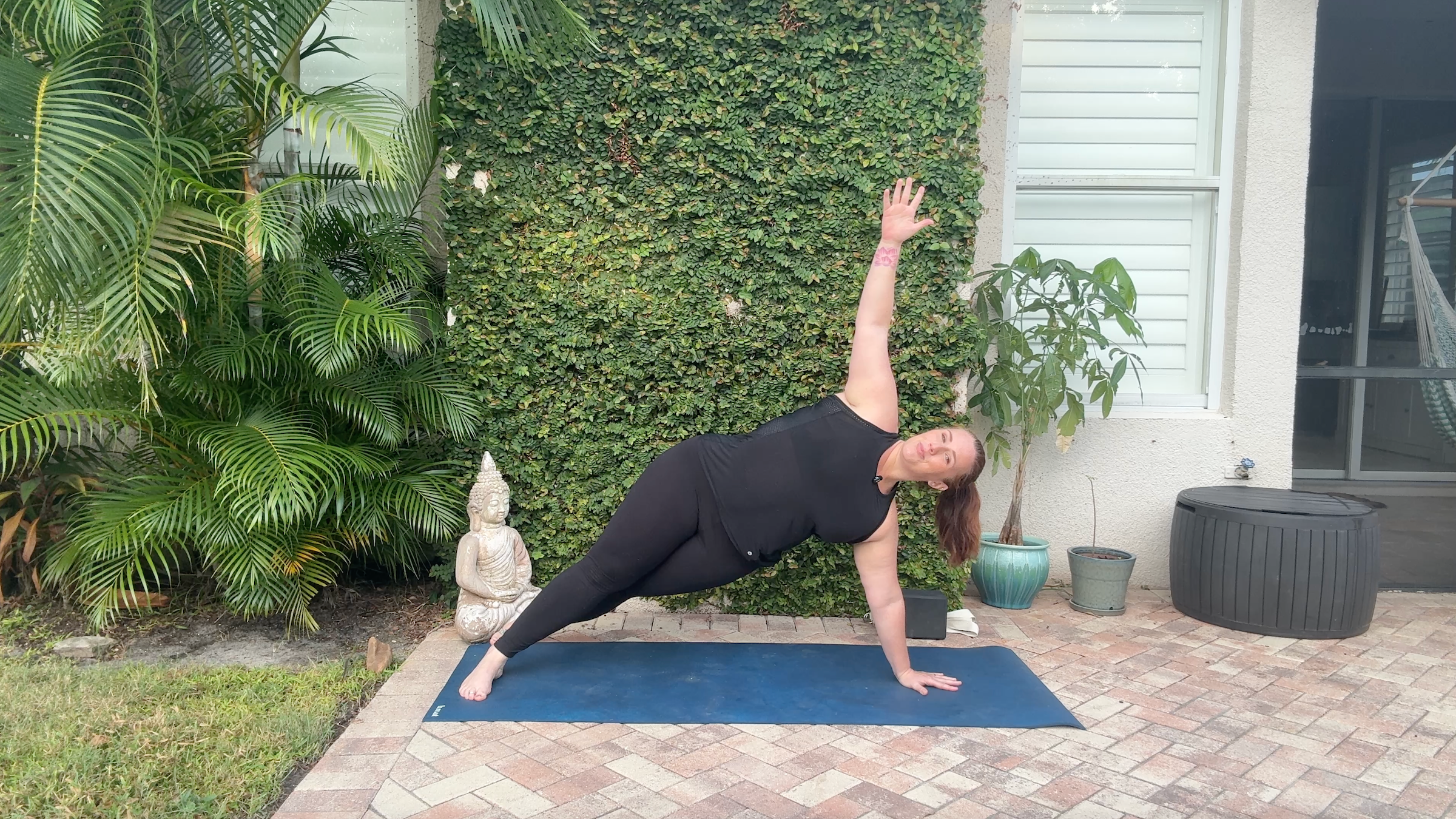 Denver Clark doing in Side Plank, part of her yoga for arm strength practice.