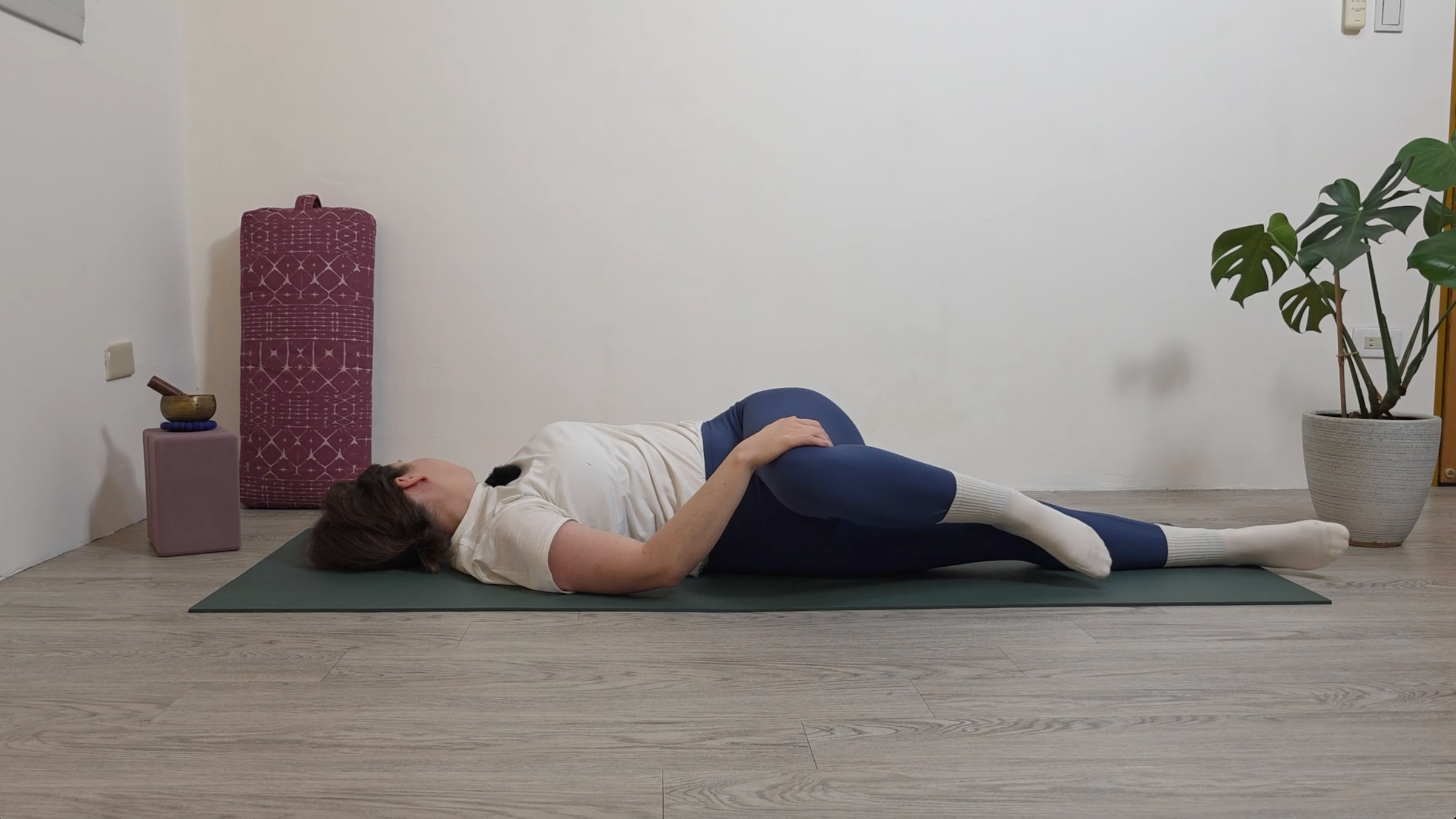 Yoga teacher Katie McGrath in Reclined Twist, part of her yin yoga practice for beginners