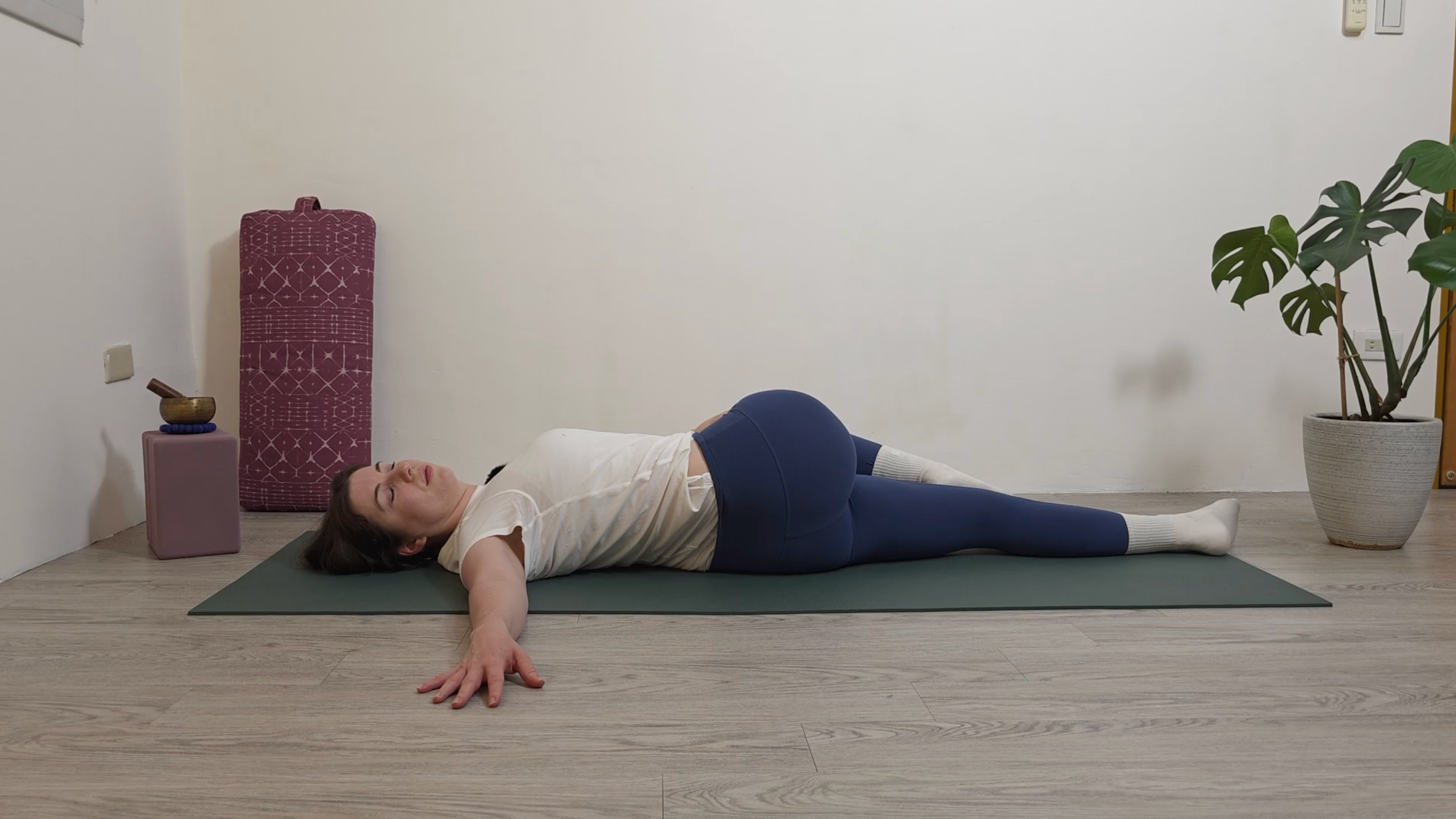 Yoga teacher Katie McGrath in Reclined Twist, part of her yin yoga practice for beginners