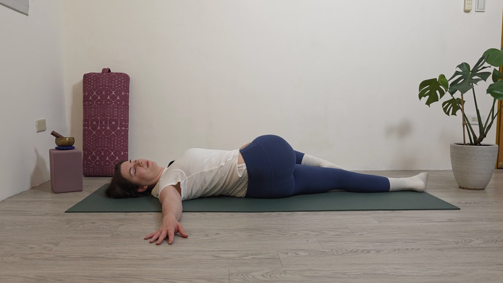 Yoga teacher Katie McGrath in Reclined Twist, part of her yin yoga practice for beginners