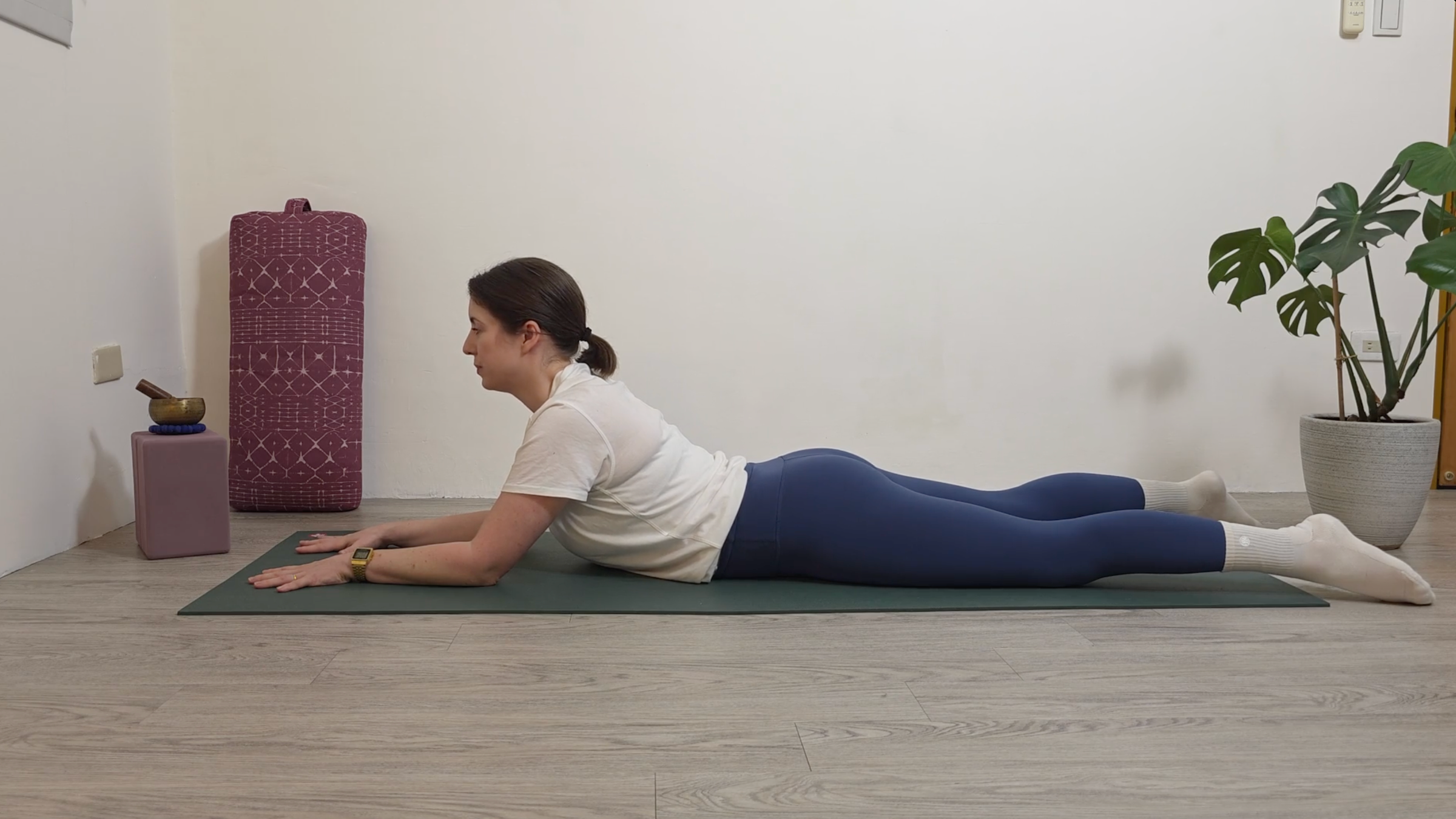 Yoga teacher Katie McGrath in Sphinx Pose, part of her yin yoga practice for beginners