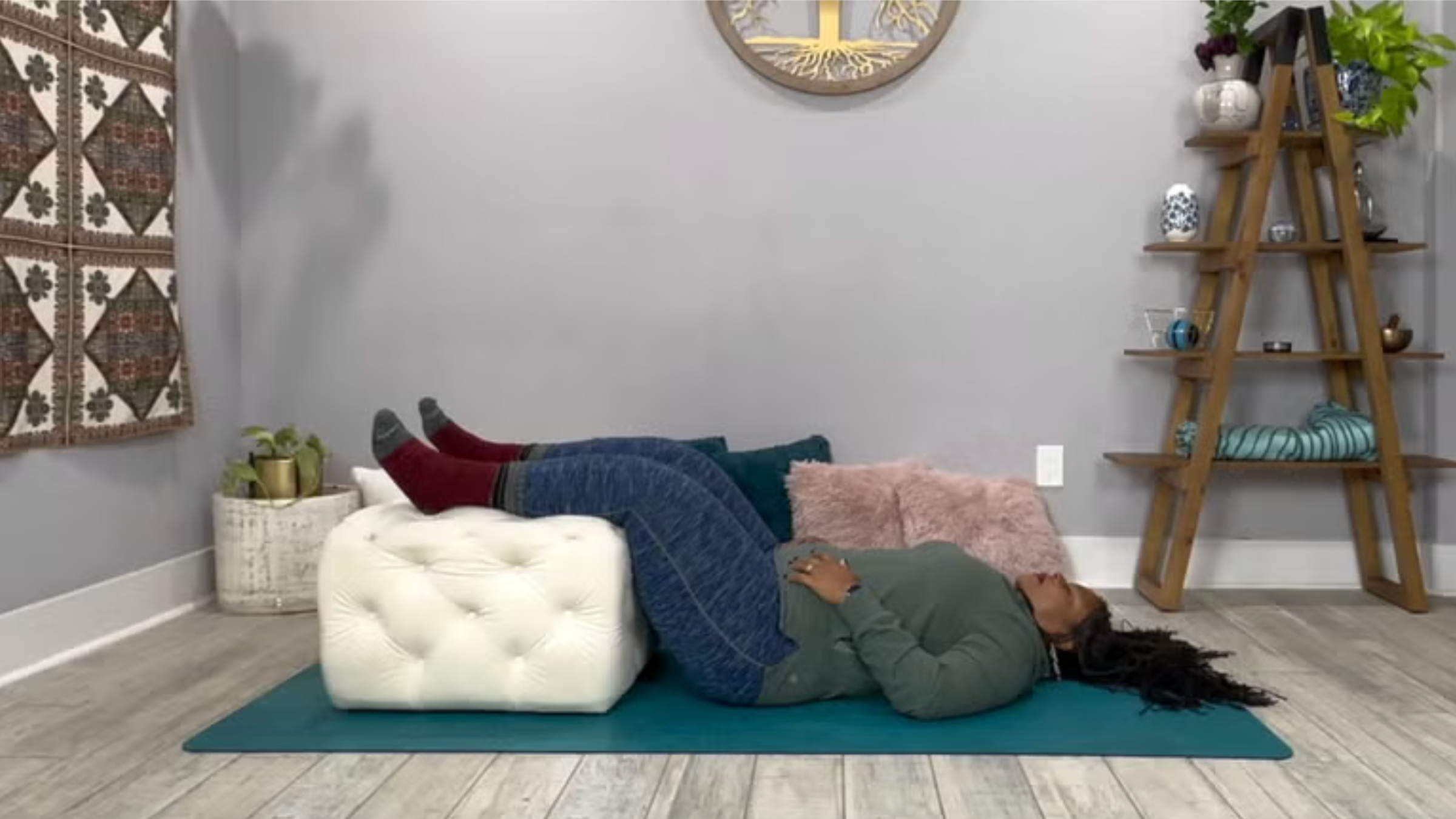 Yoga teach Tamika Caston-Miller in Half Legs Up the Wall, a yoga for sleep pose