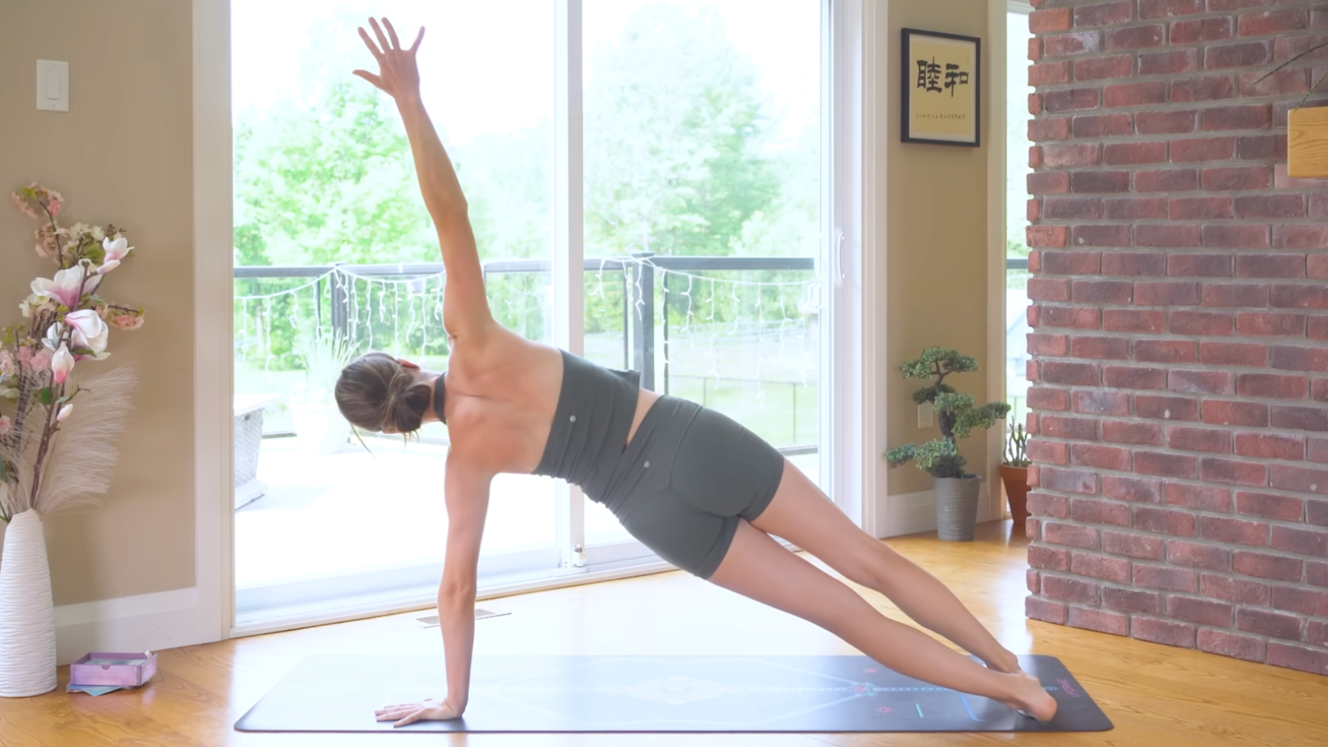 Woman in Side Plank on a yoga mat