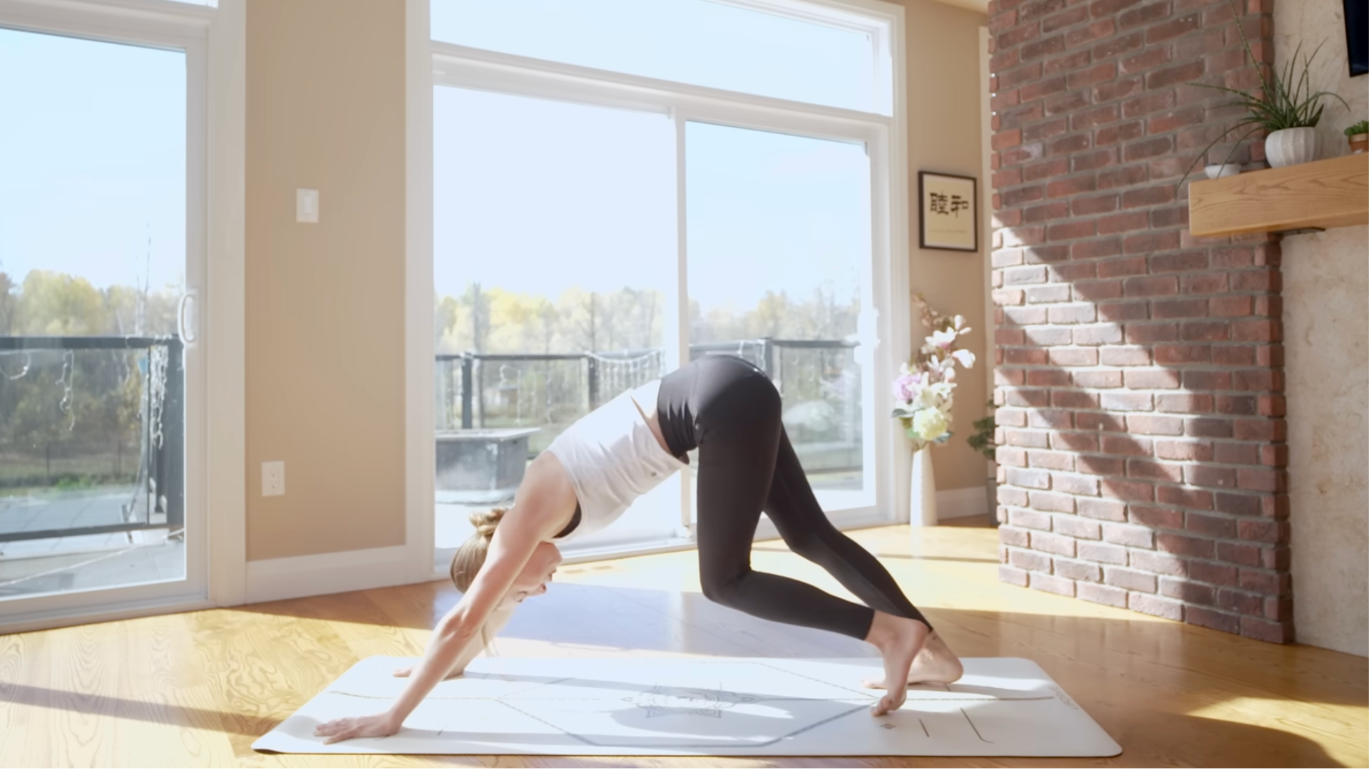 Yoga teacher during 10-minute yoga practicing Downward-Facing Dog