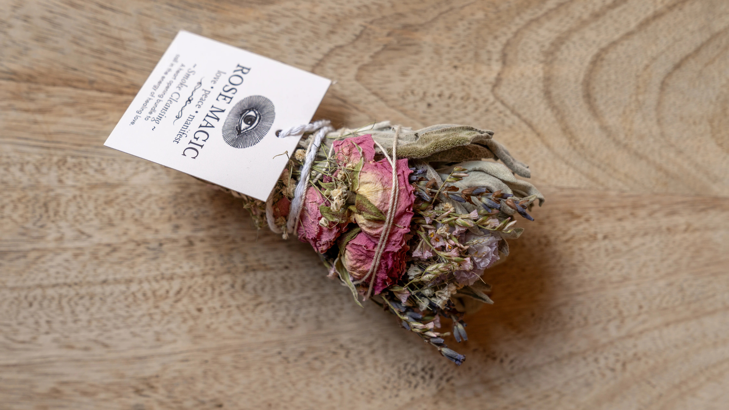 Rose Magic smoke bundle with roses on wooden table, best yogi gifts