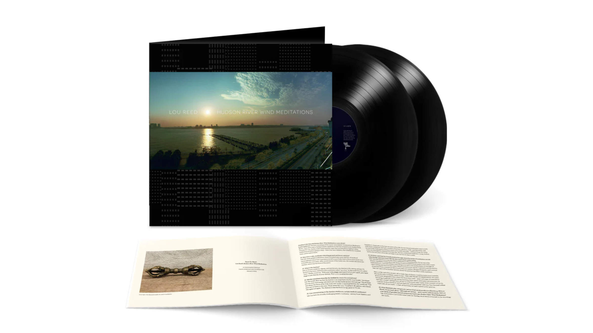 Lou Reed vinyl record album cover with two black records next to it on white background