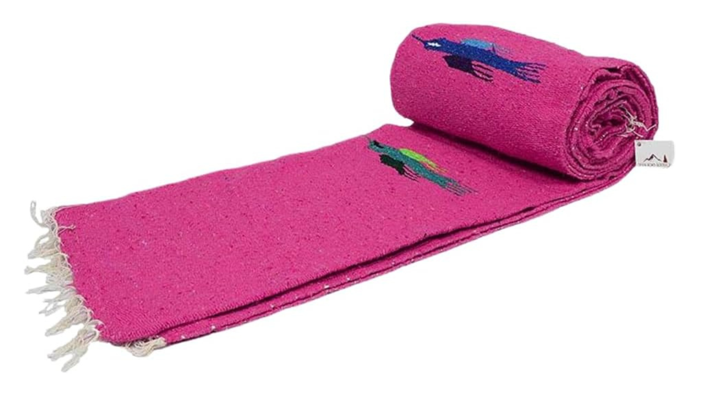 pink Mexican-style yoga blanket half unrolled on white background, best yoga gifts