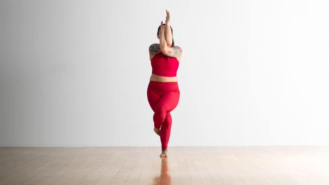A woman in Eagle Pose