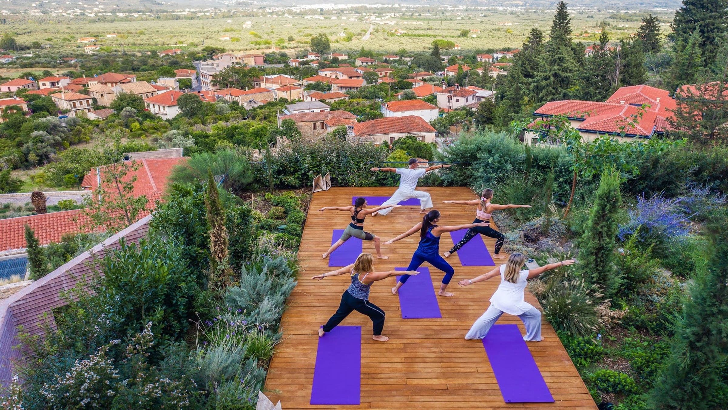 People practicing yoga at Euphoria Retreat in Greece