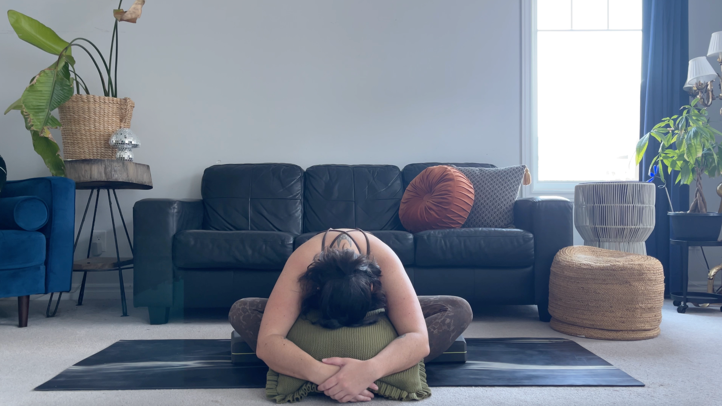 Yoga teacher Taylor Lorenz in Butterfly Pose, part of her yin yoga practice
