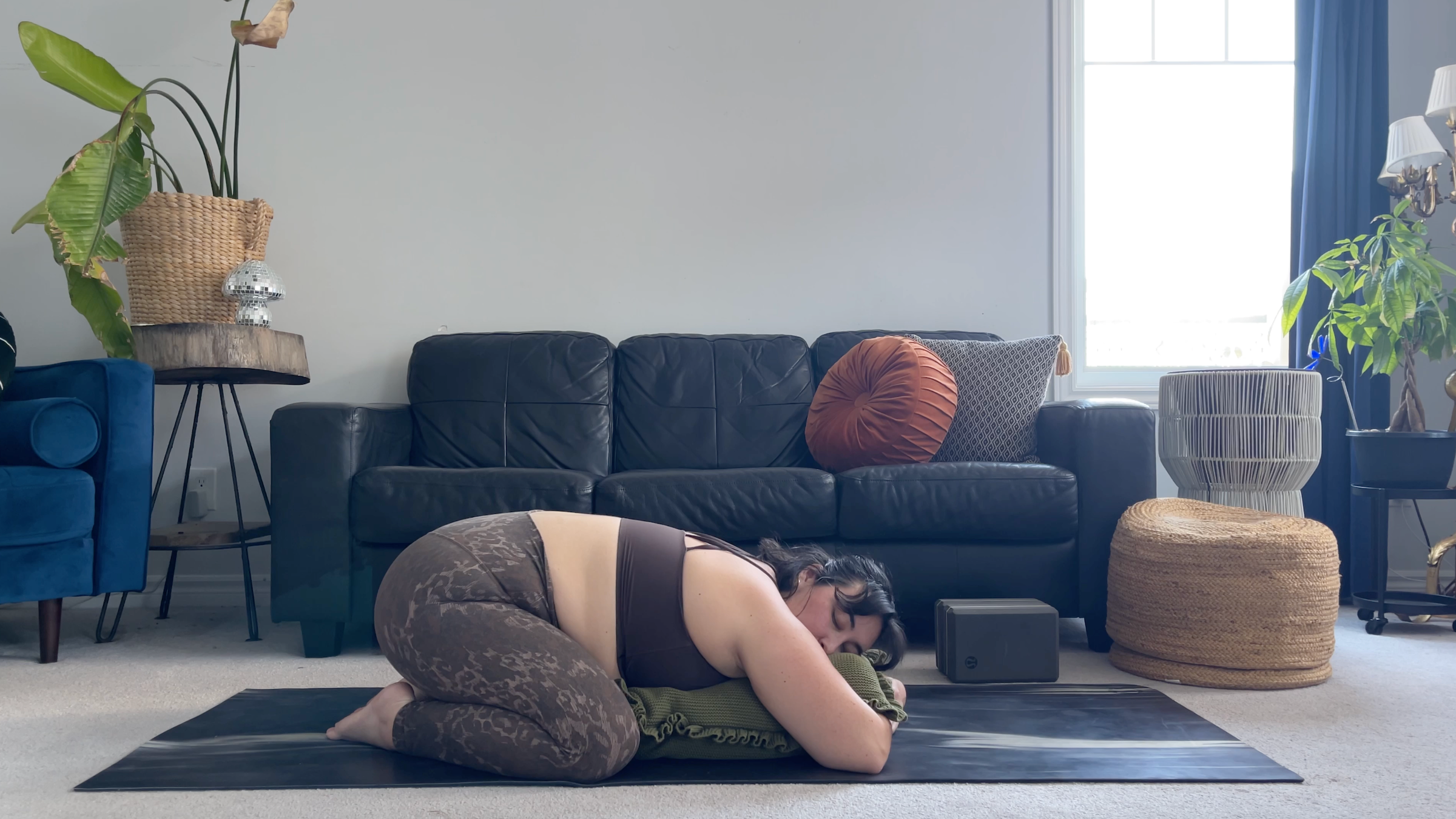 Yoga teacher Taylor Lorenz in Child's Pose, part of her yin yoga practice
