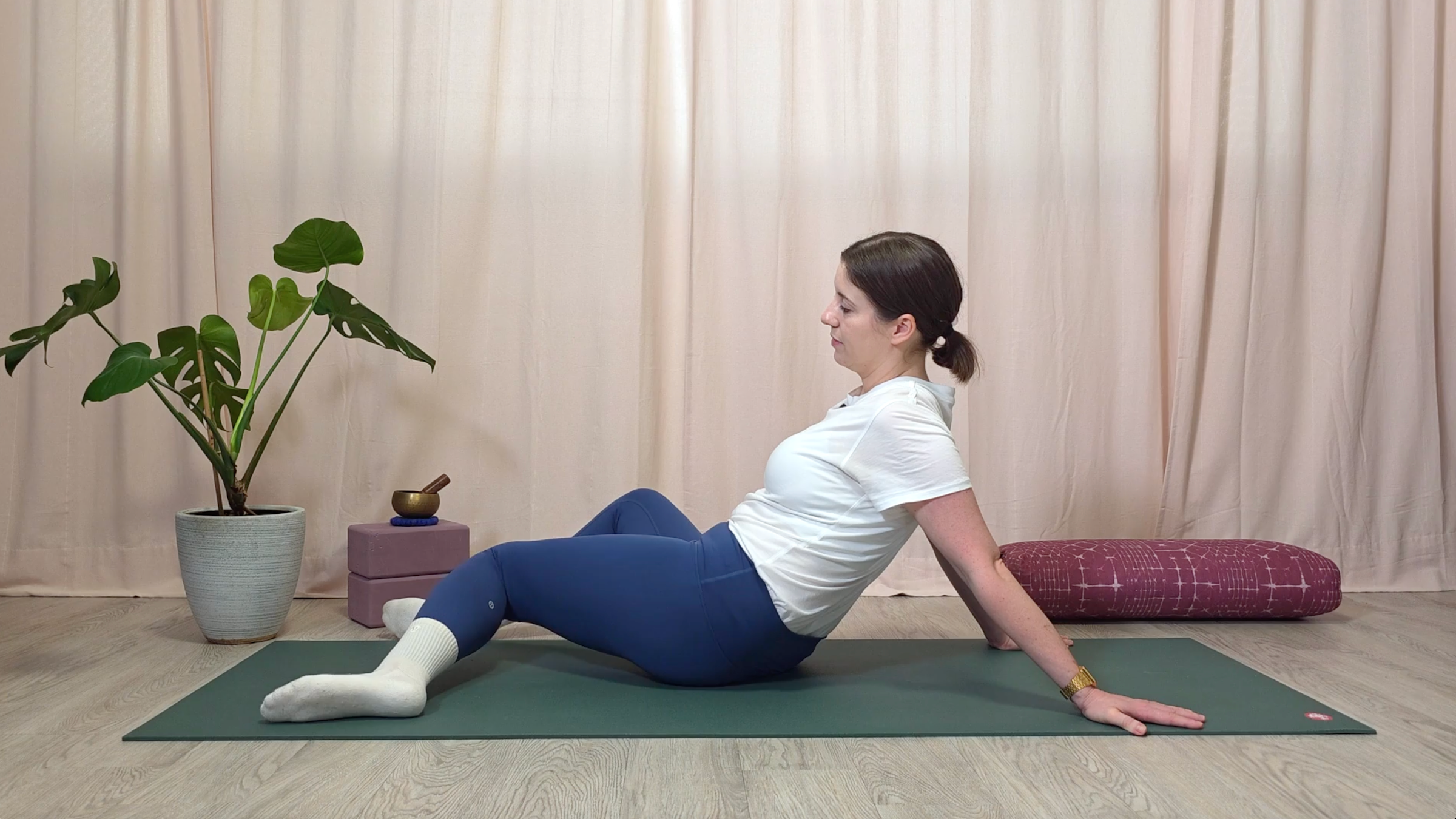 Yin yoga teacher Katie McGrath doing Windshield Wipers