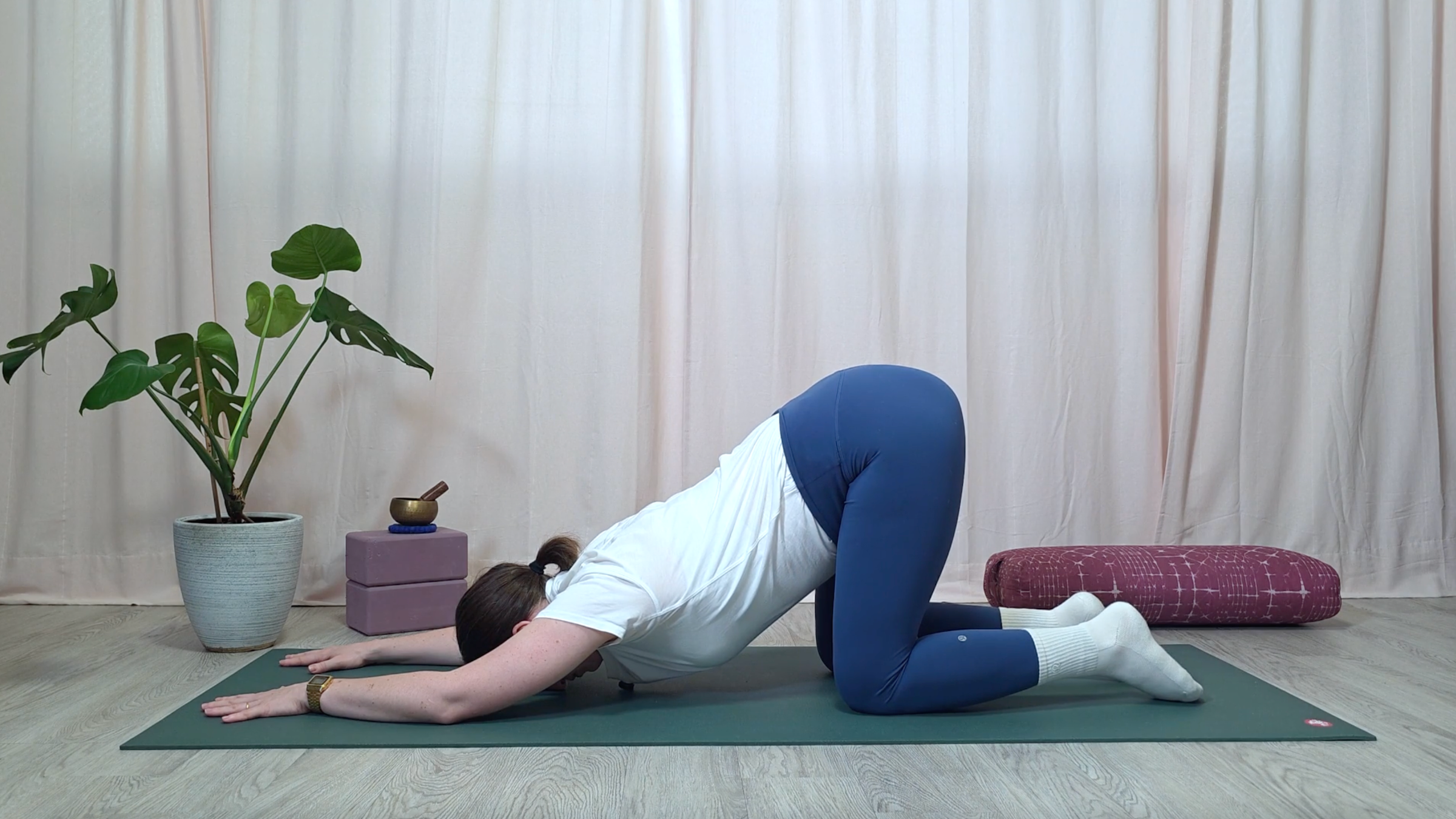 Yoga teacher Katie McGrath in Melting Heart Pose