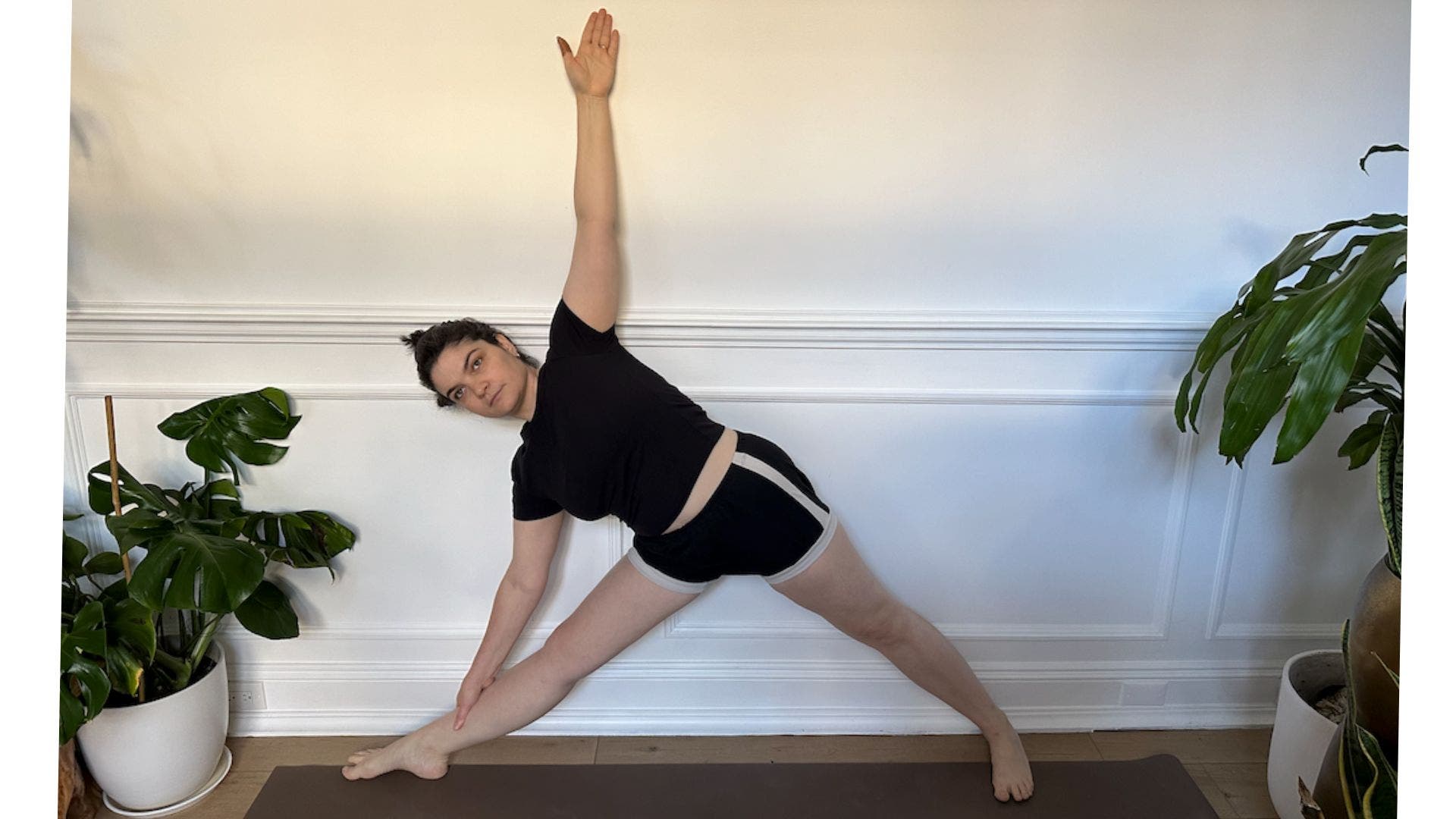 Triangle Pose against the wall