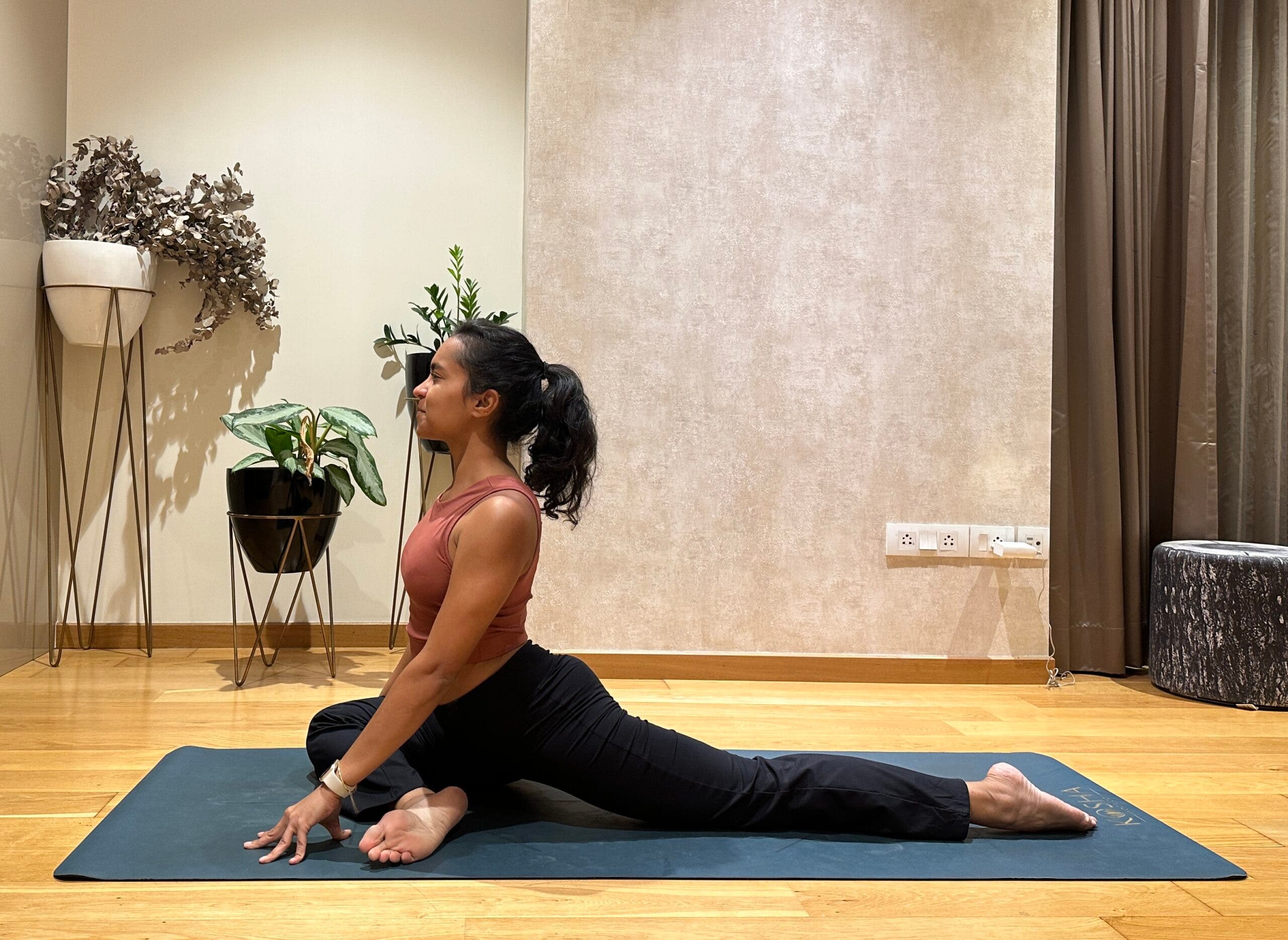 Riya Davda practicing Pigeon Pose