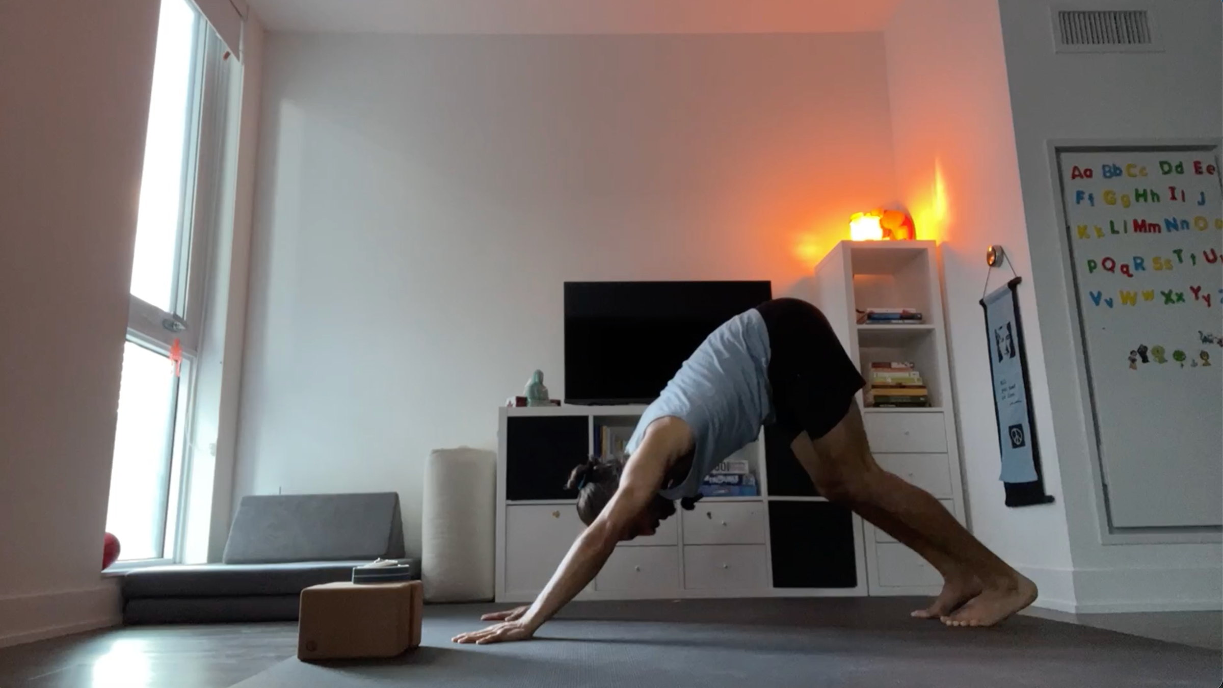 Yoga teacher Jaffer Hussain in Downward-Facing Dog, part of his simple yoga flow