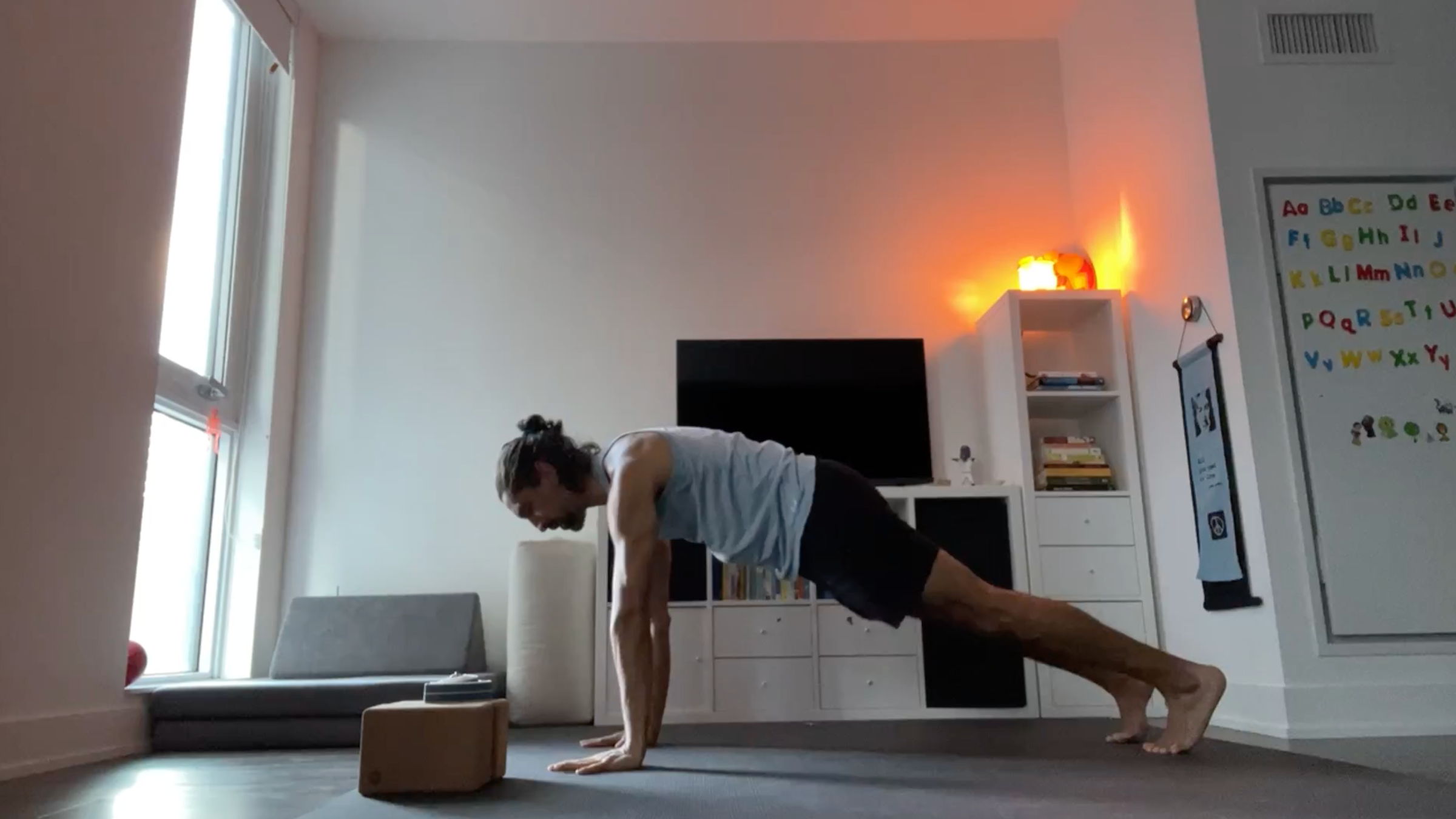 Yoga teacher Jaffer Hussain in Plank Pose, part of his simple yoga flow