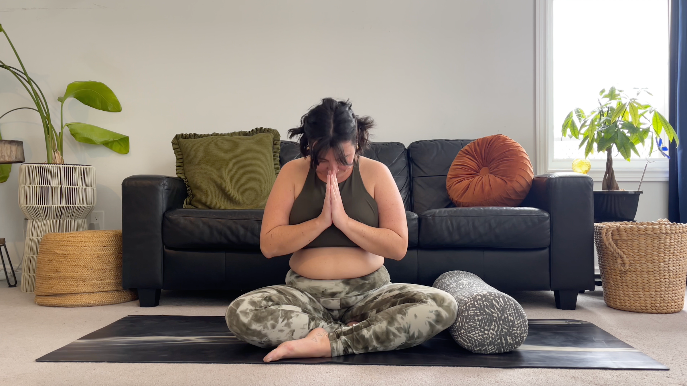 Yoga teacher Taylor Lorenz in Closing Pose, part of her yin yoga practice for the winter solstice