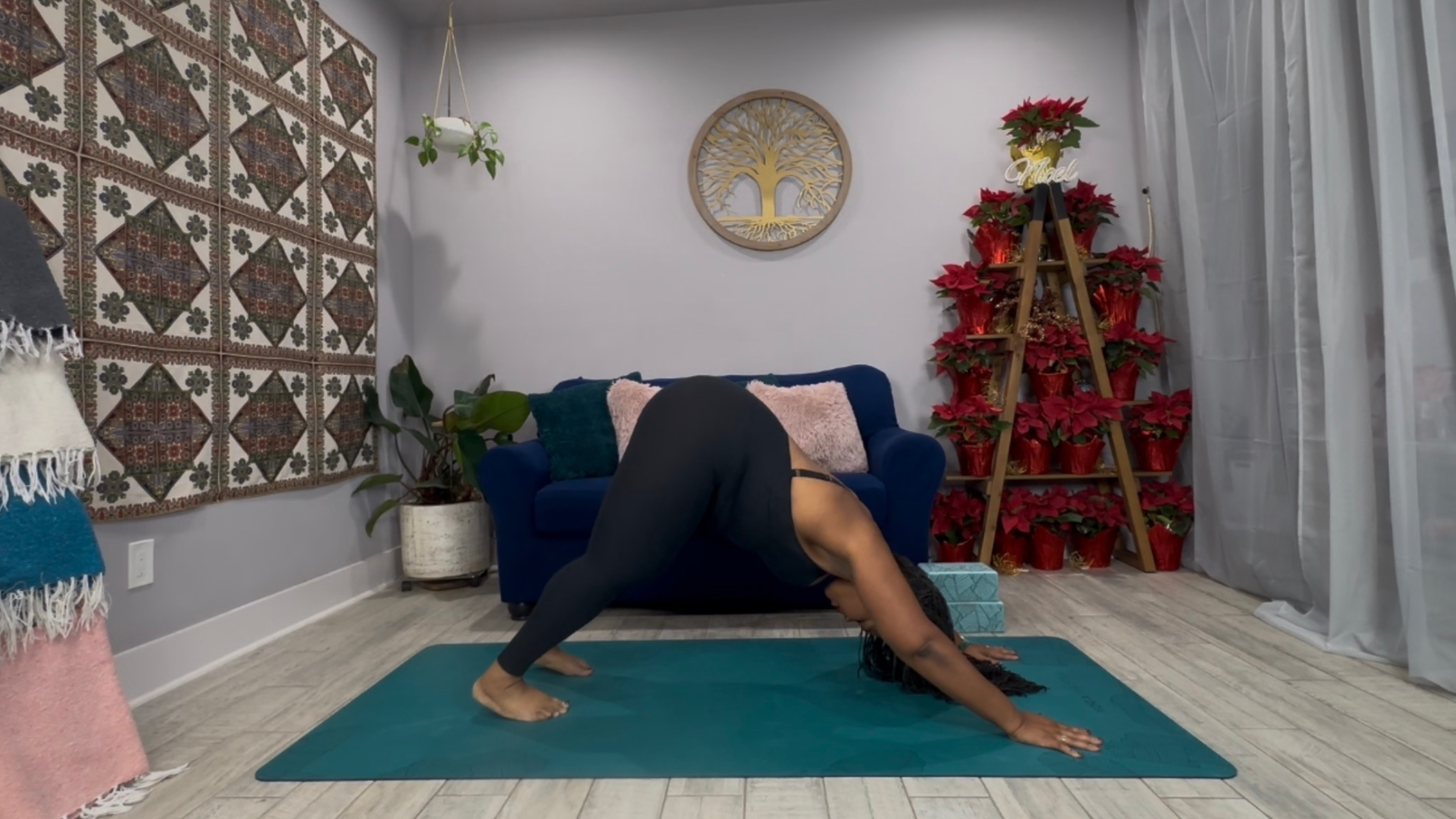 Woman in Downward-Facing dog on a yoga mat