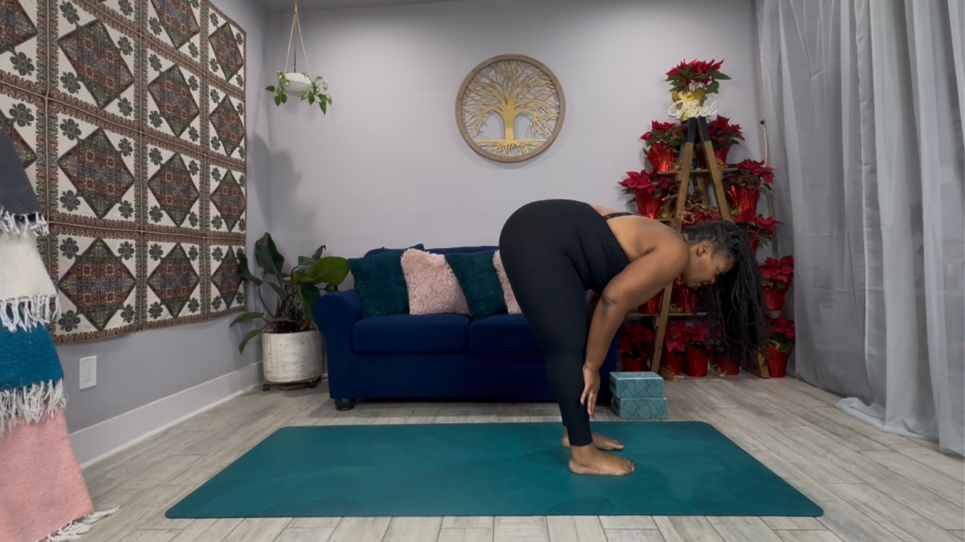 Woman standing in a half lift on a yoga mat