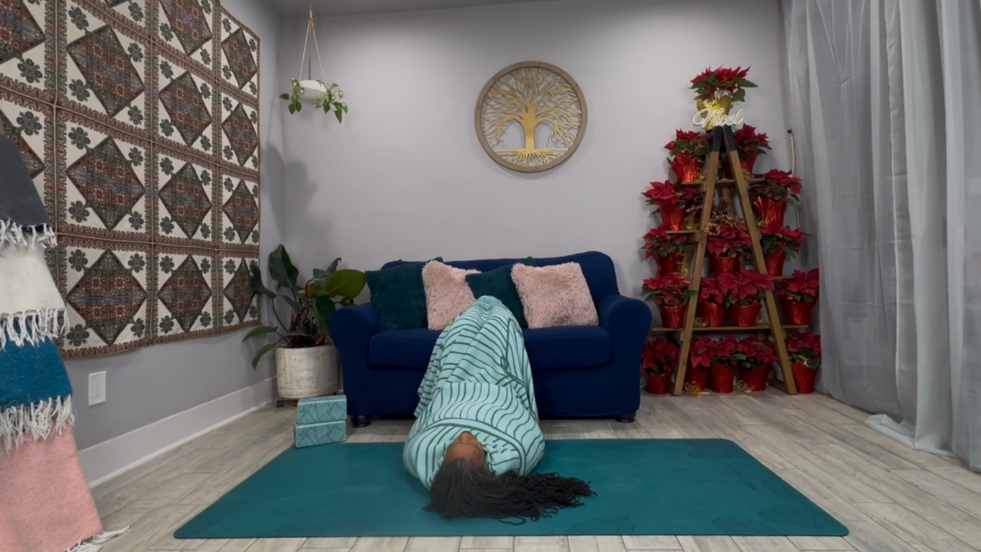 Woman lying on the floor with her legs resting on the sofa