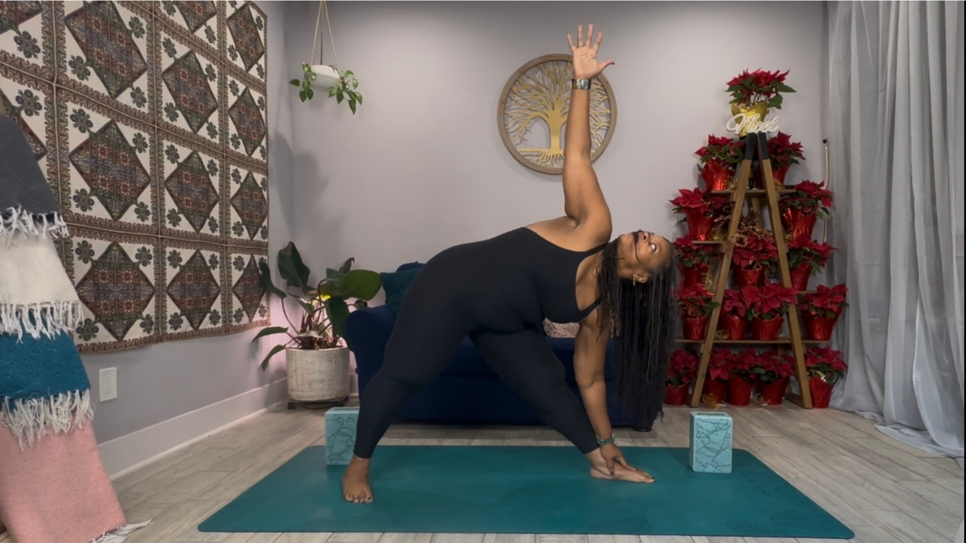 Woman on a yoga mat in Triangle Pose