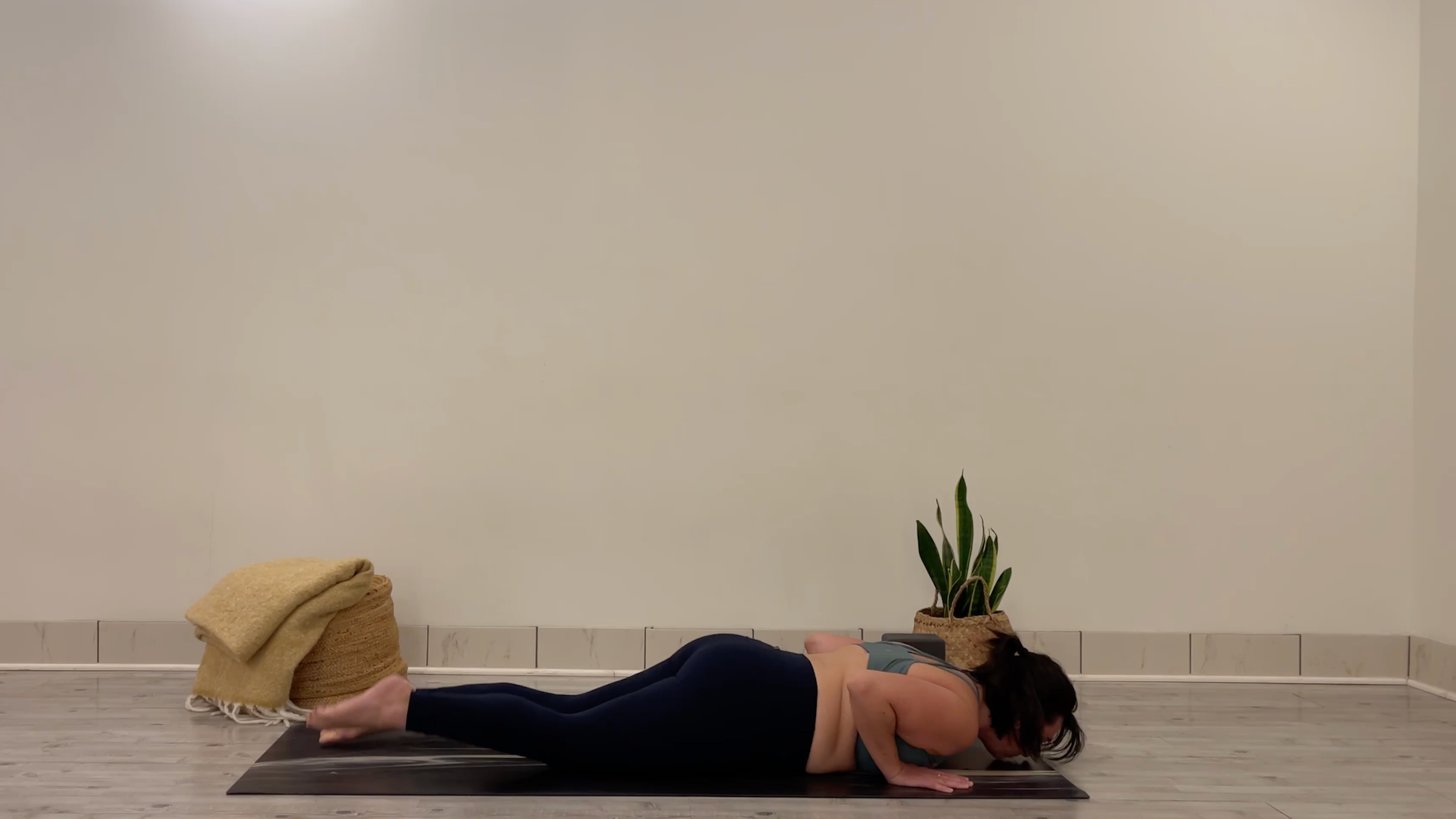 Teacher Taylor Lorenz in Chaturanga, part of her yoga for focus practice