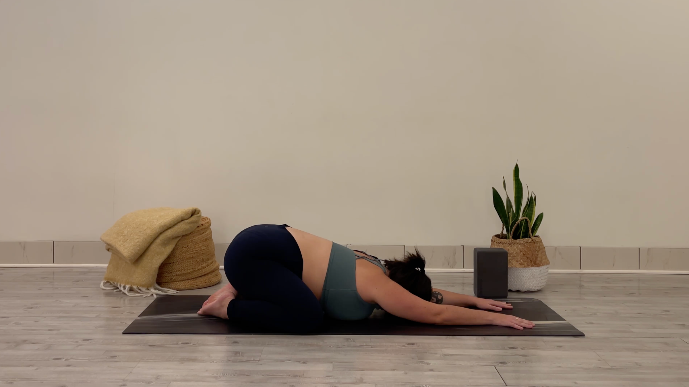 Teacher Taylor Lorenz in Child's Pose