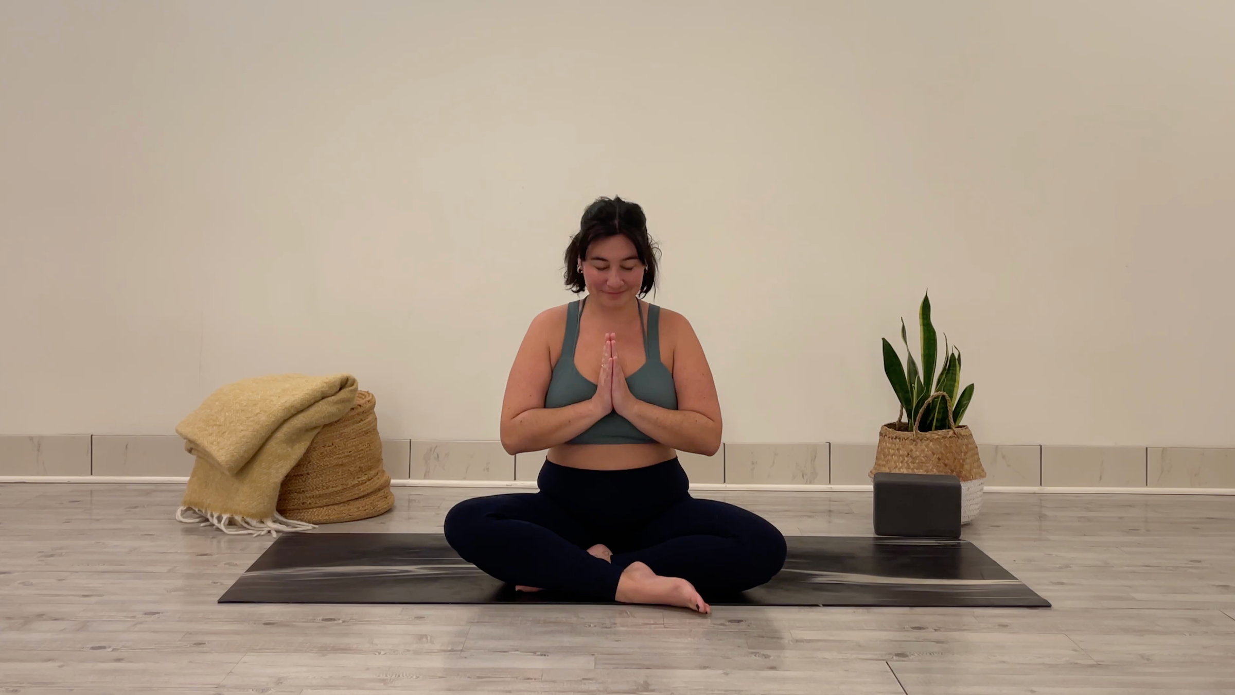 Yoga teacher Taylor Lorenz in Closing Pose, part of her yoga for focus practice