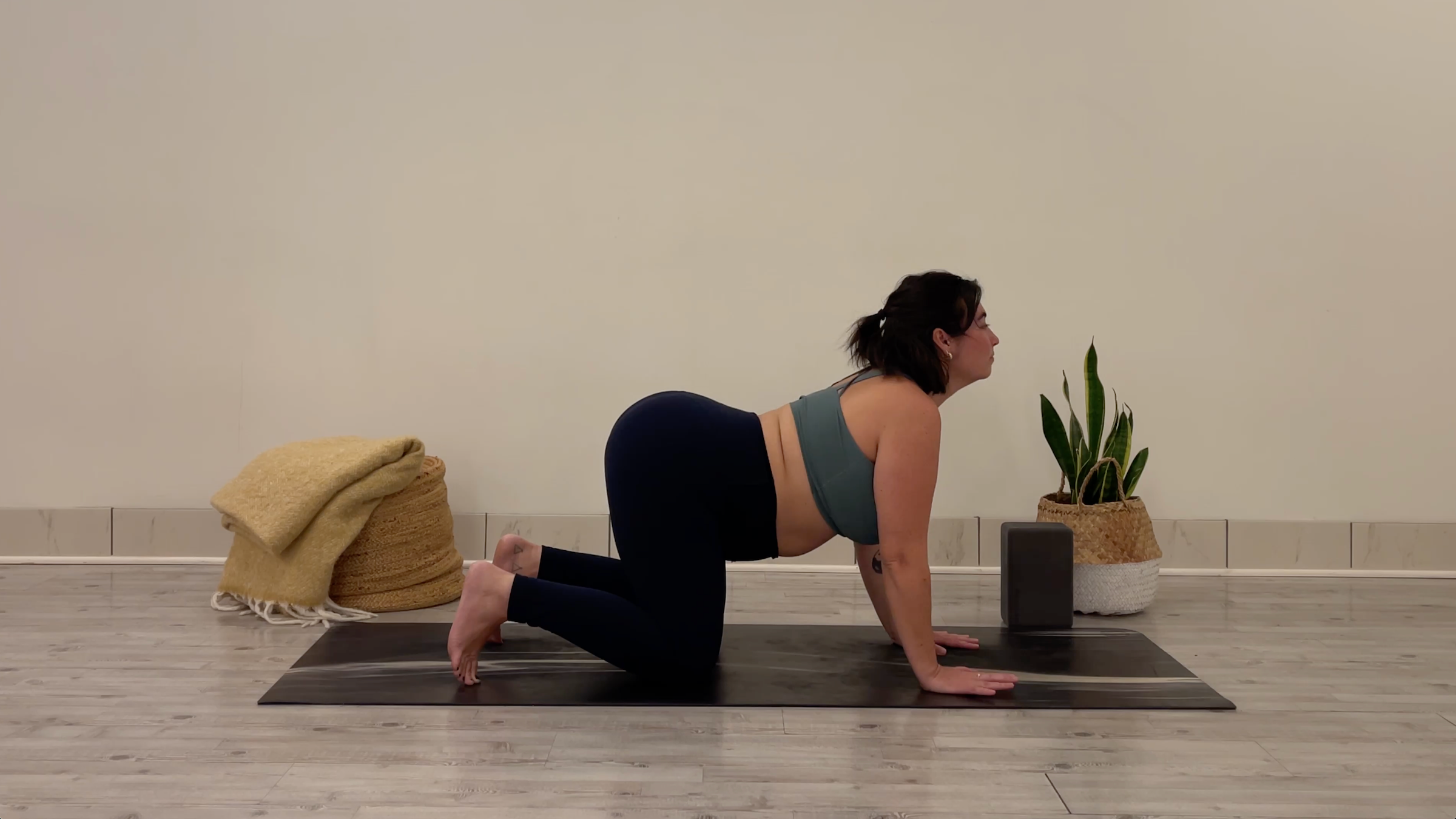 Yoga teacher Taylor Lorenz in Cow Pose, part of her yoga for focus practice