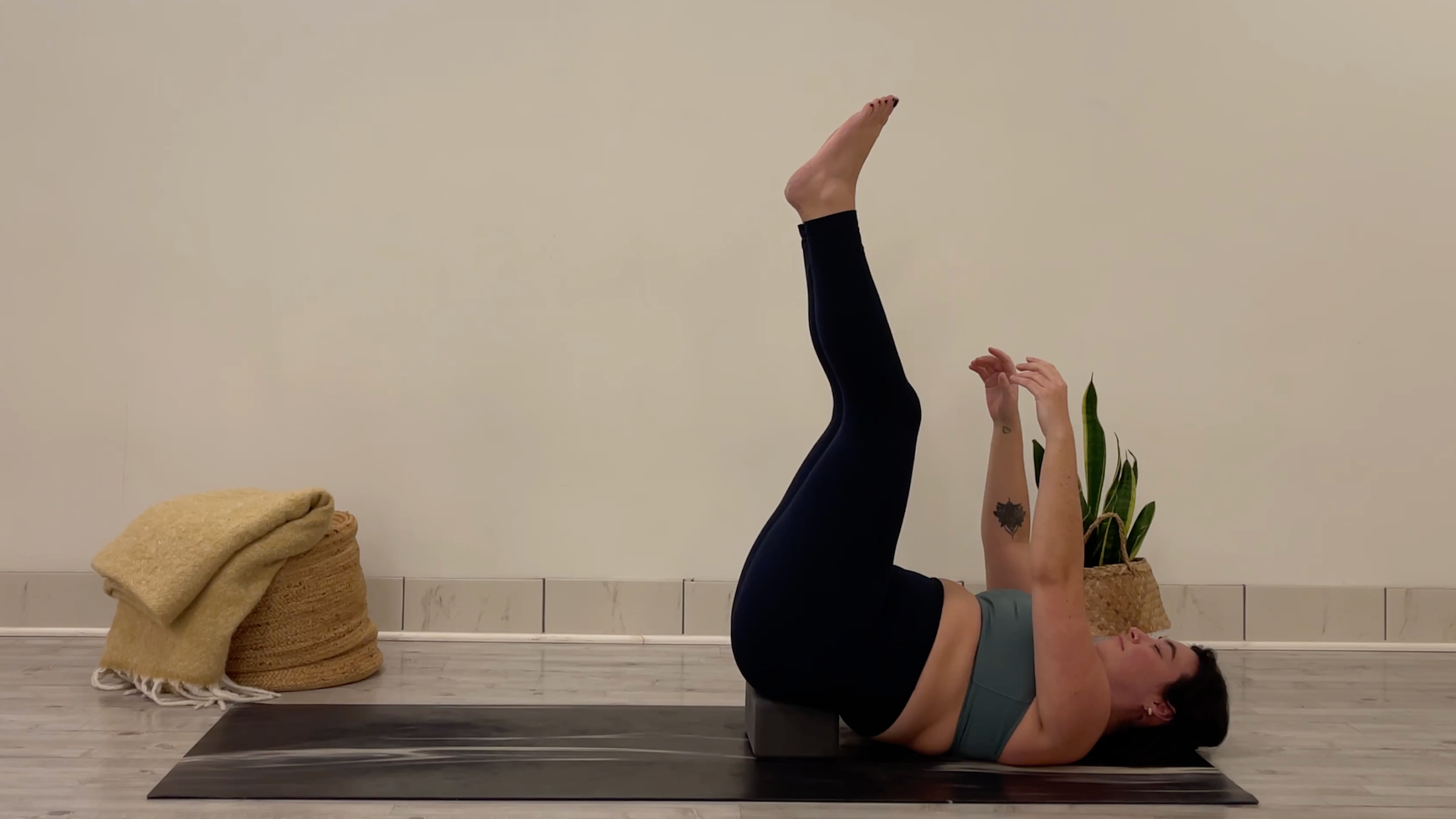 Teacher Taylor Lorenz in Dead Bug Pose