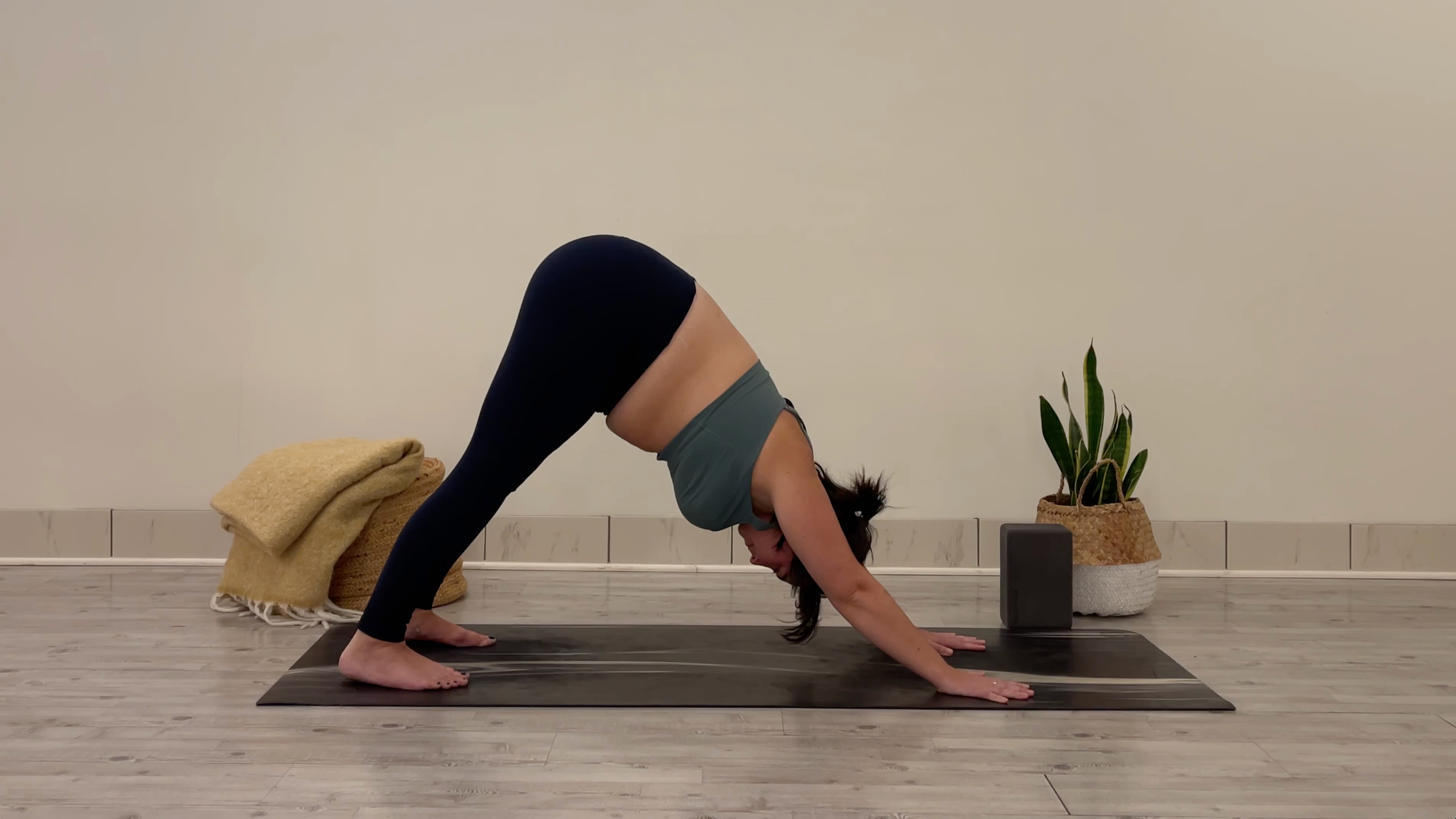 Teacher Taylor Lorenz in Downward-Facing Dog, part of her yoga for focus practice