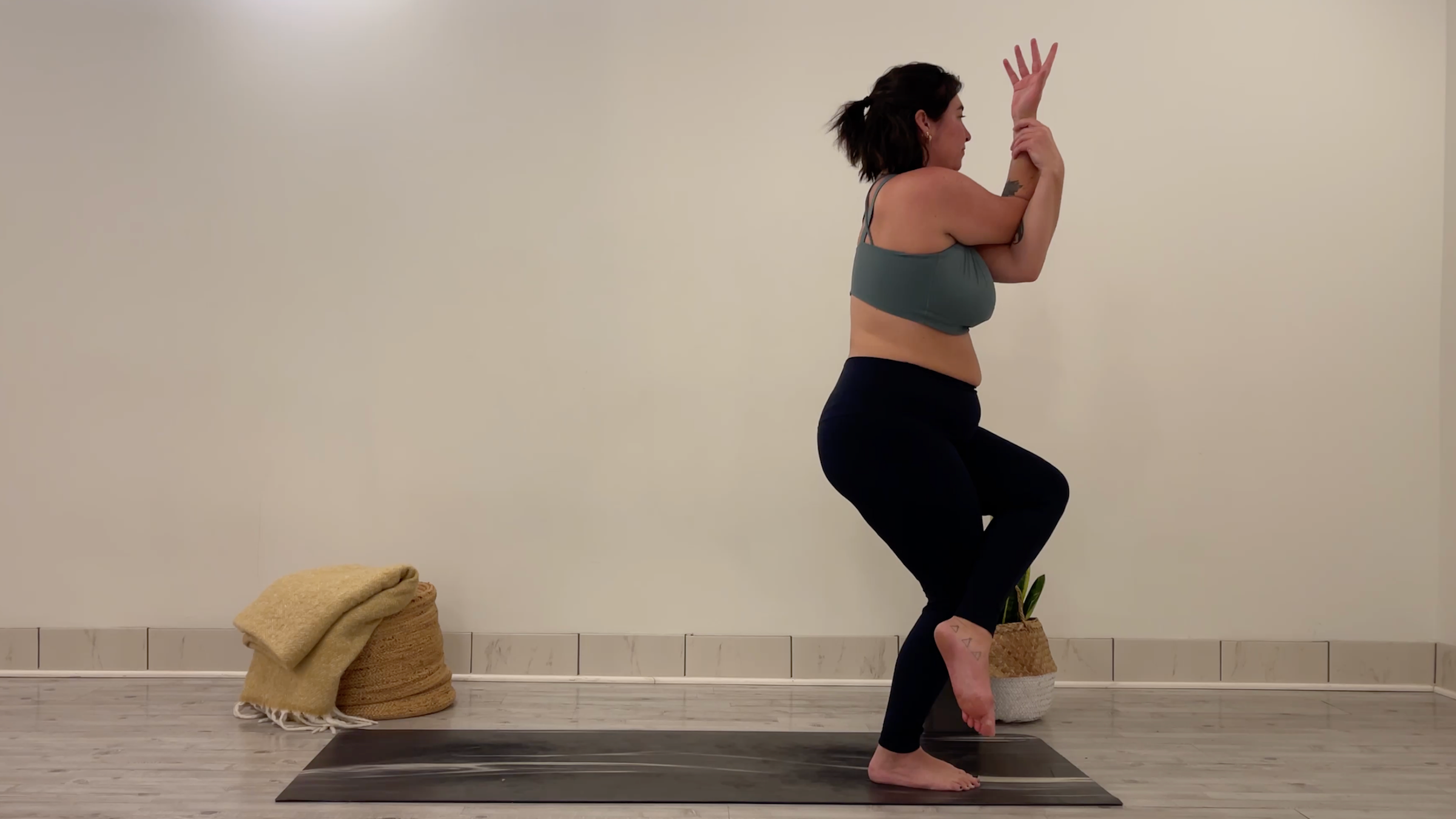 Teacher Taylor Lorenz in Eagle Pose