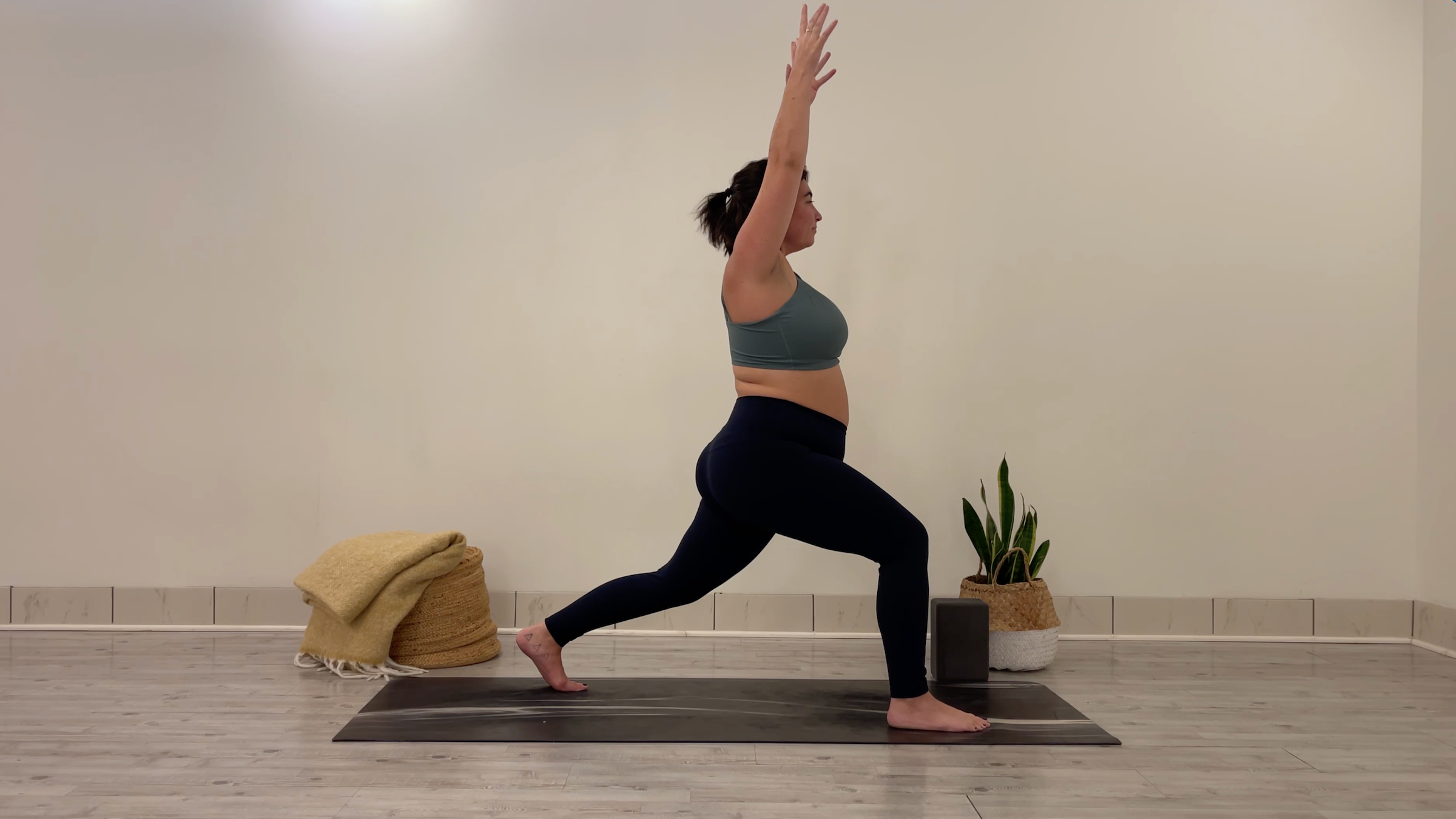 Teacher Taylor Lorenz in High Crescent Lunge