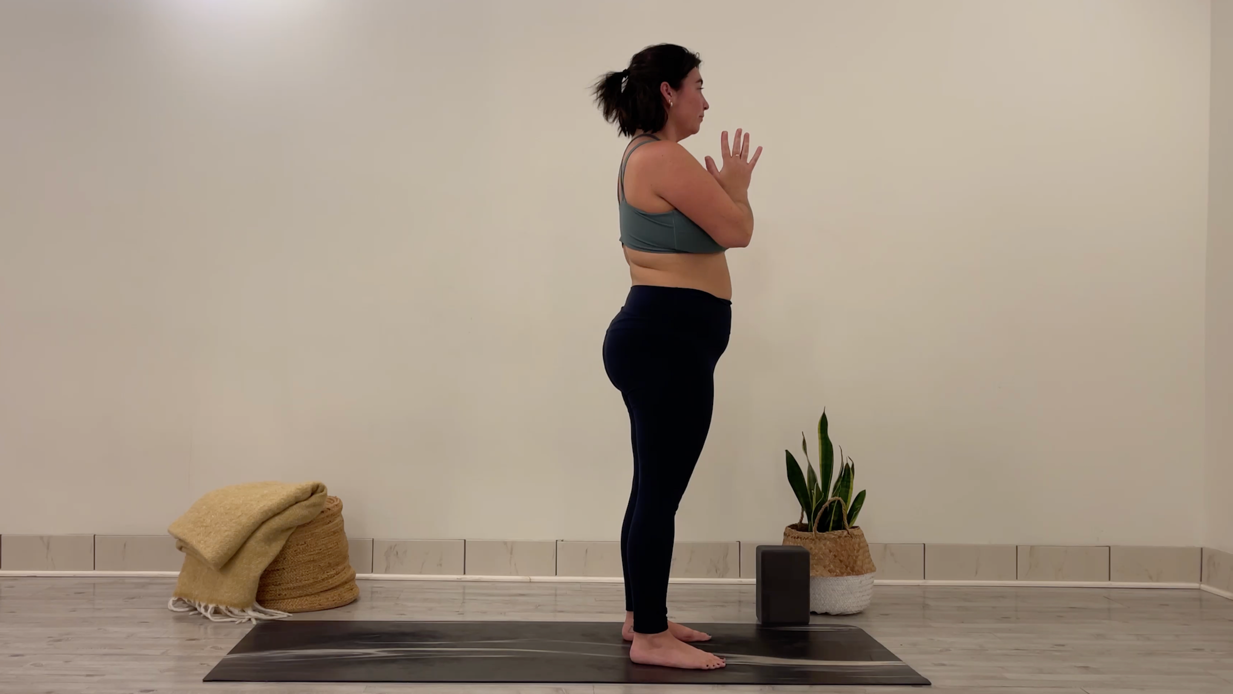 Teacher Taylor Lorenz in Mountain Pose, part of her yoga for focus practice