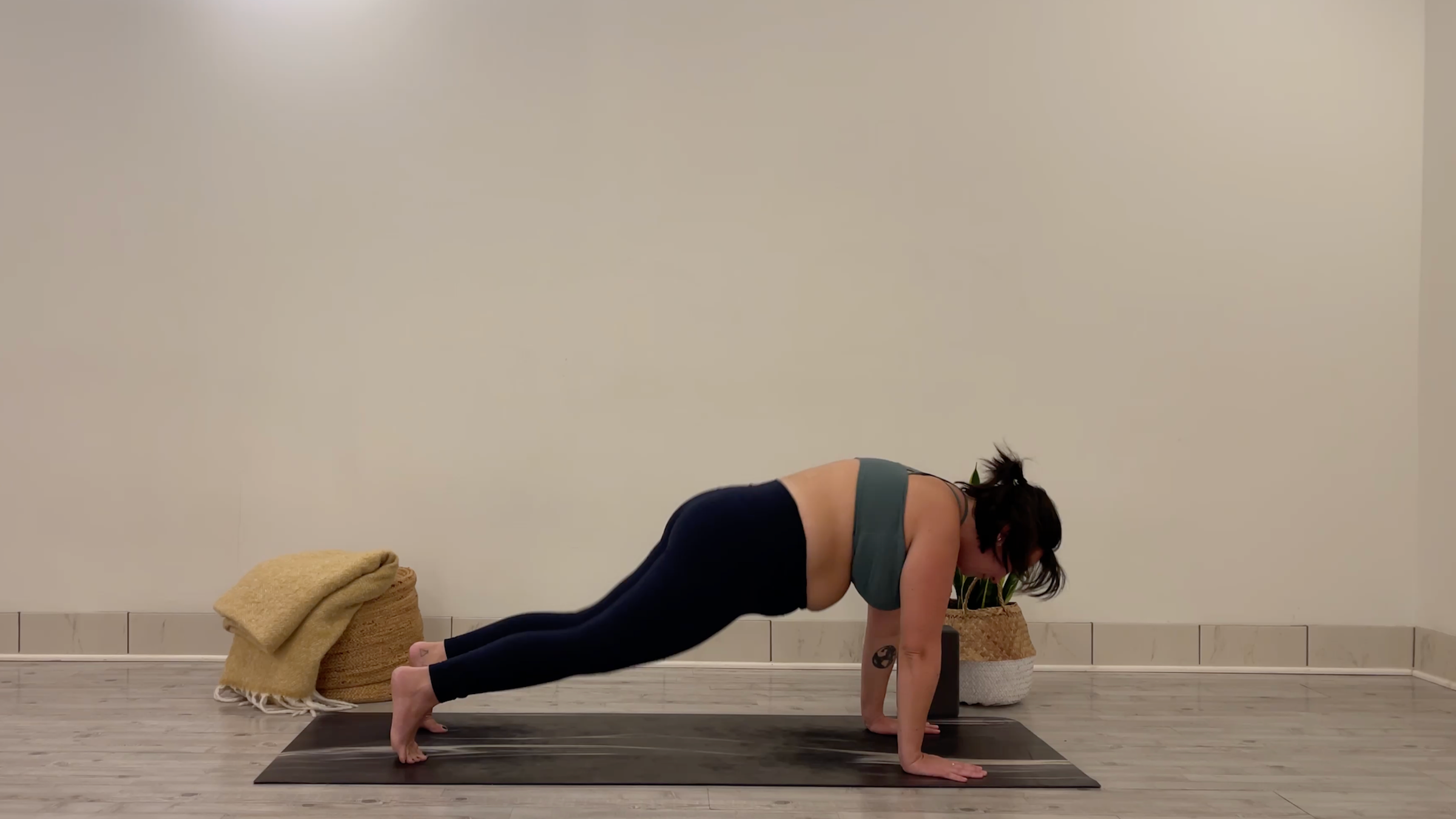 Yoga teacher Taylor Lorenz in Plank Pose, part of her yoga for focus practice