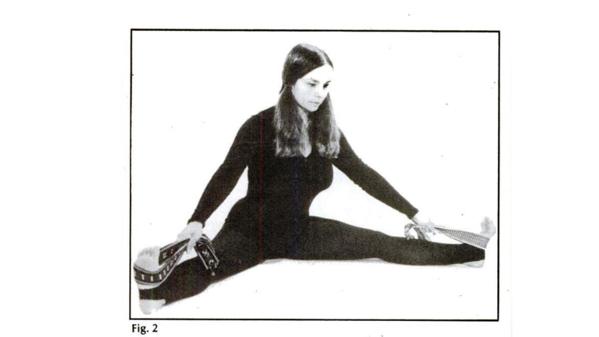 Image of woman practicing wide-legged seated forward fold.