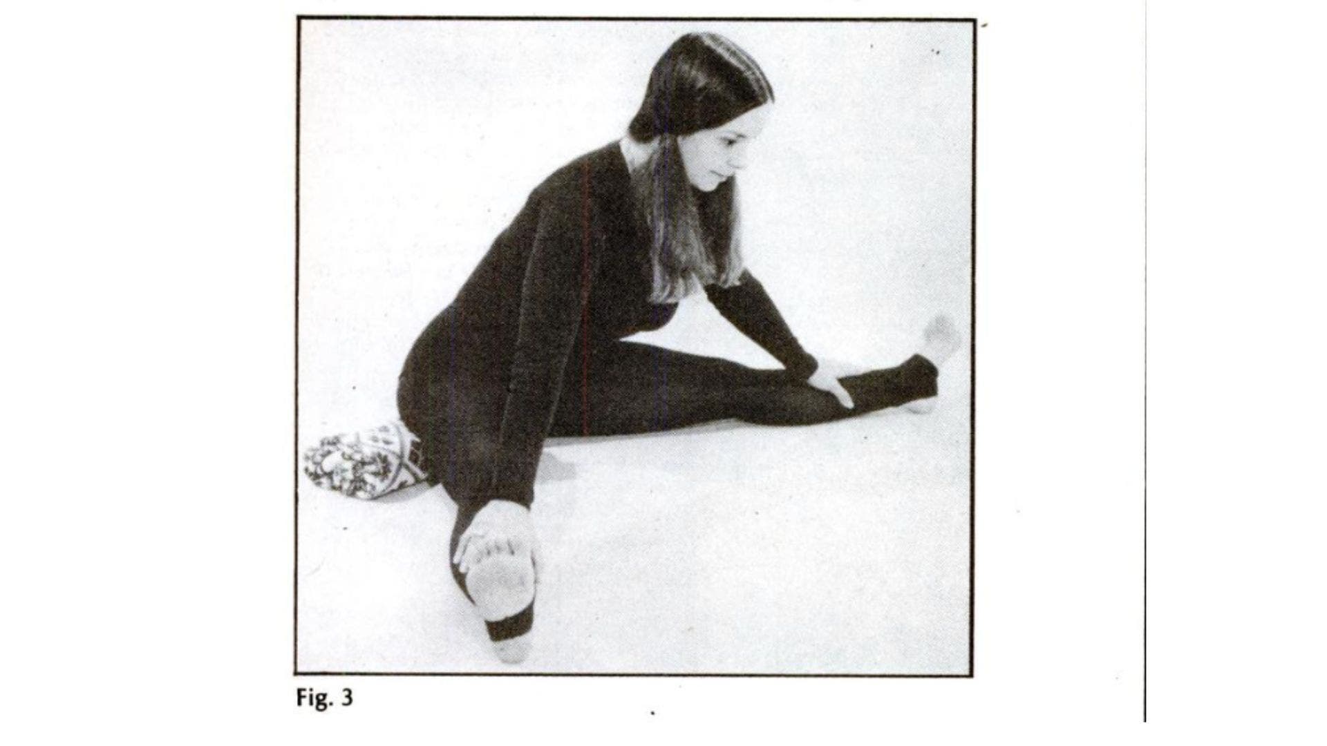 Image of woman practicing Upavistha Konasana with blanket underneath knees.