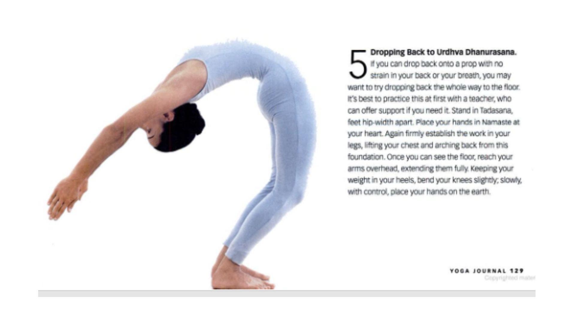 Image of woman coming into Wheel Pose, backbending with her hands a foot away from the floor.