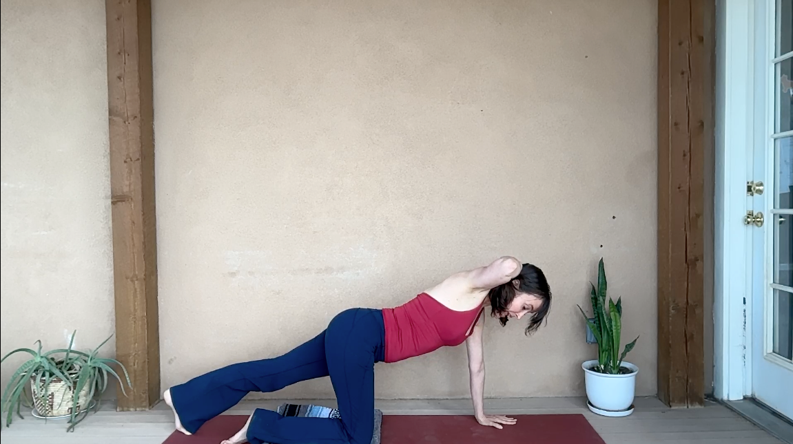 Image of woman in Tabletop with one leg straight and one arm behind her head.