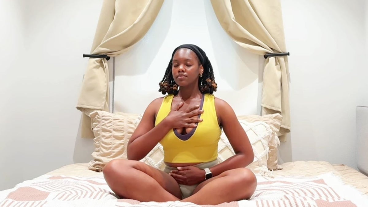 Need a Restful Night's Sleep? Here's a 10-Minute Yoga Practice You Can Do in Bed.